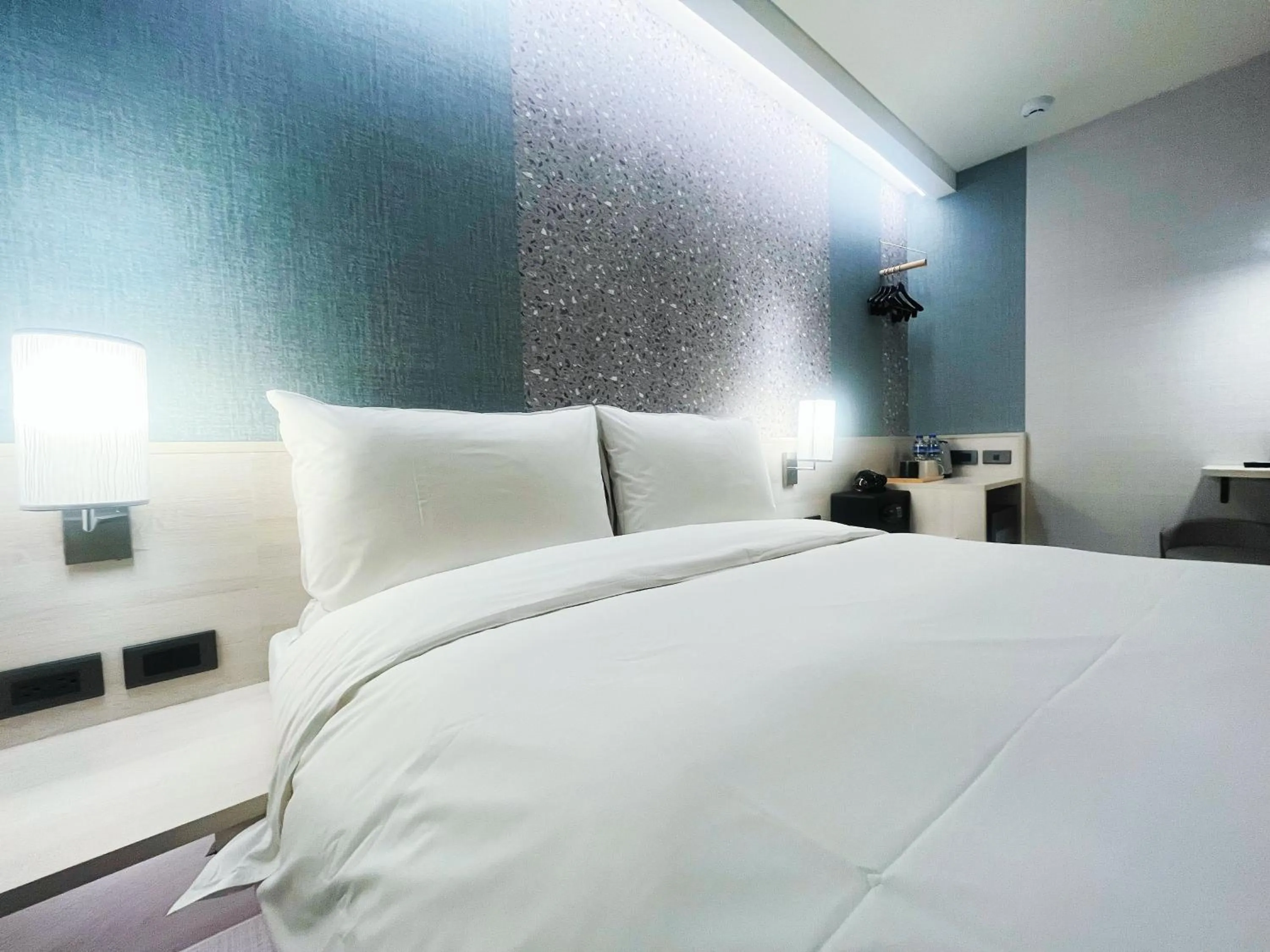 Bed in 新仕飯店-New City Hotel