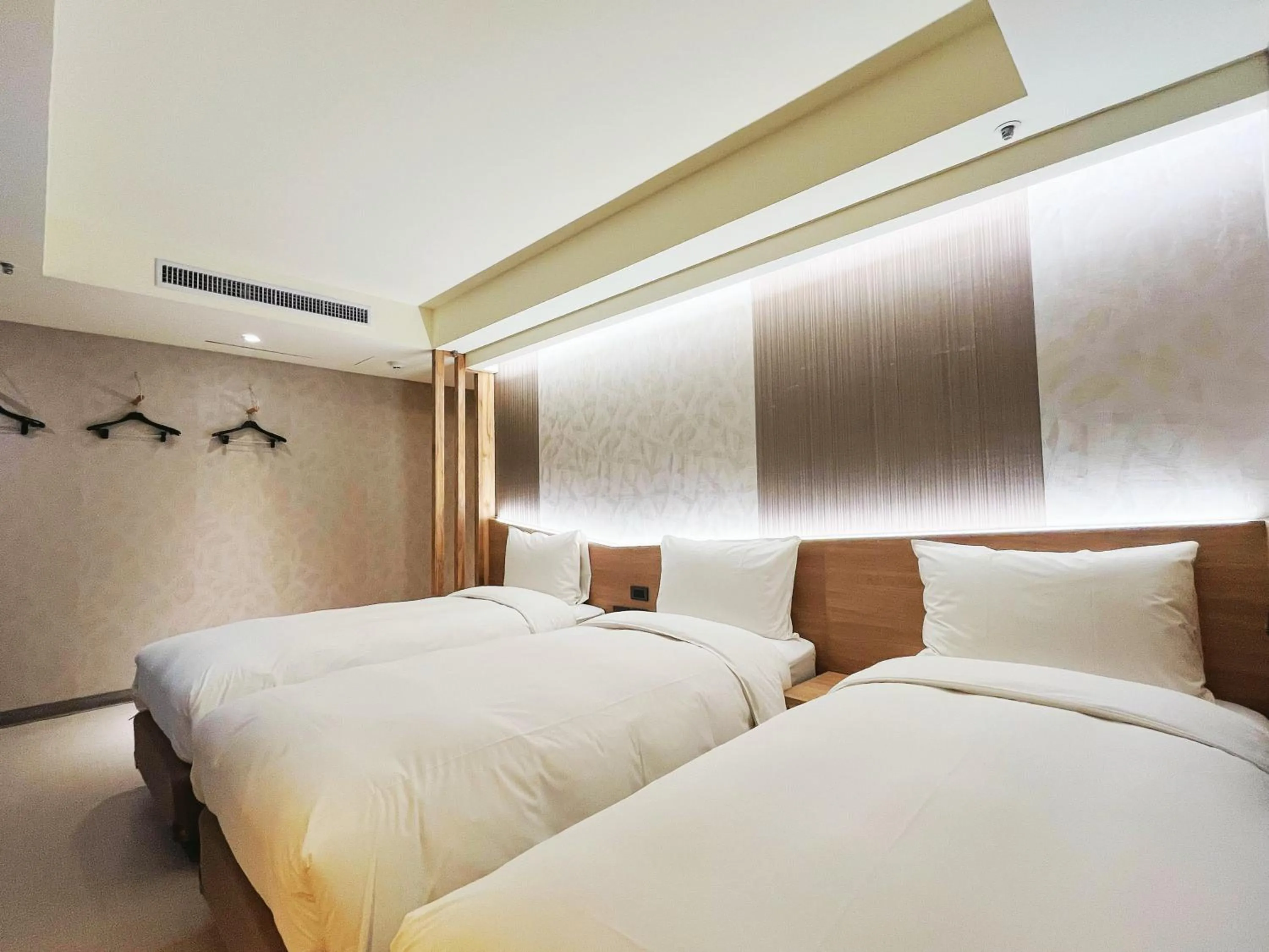 Bed in 新仕飯店-New City Hotel