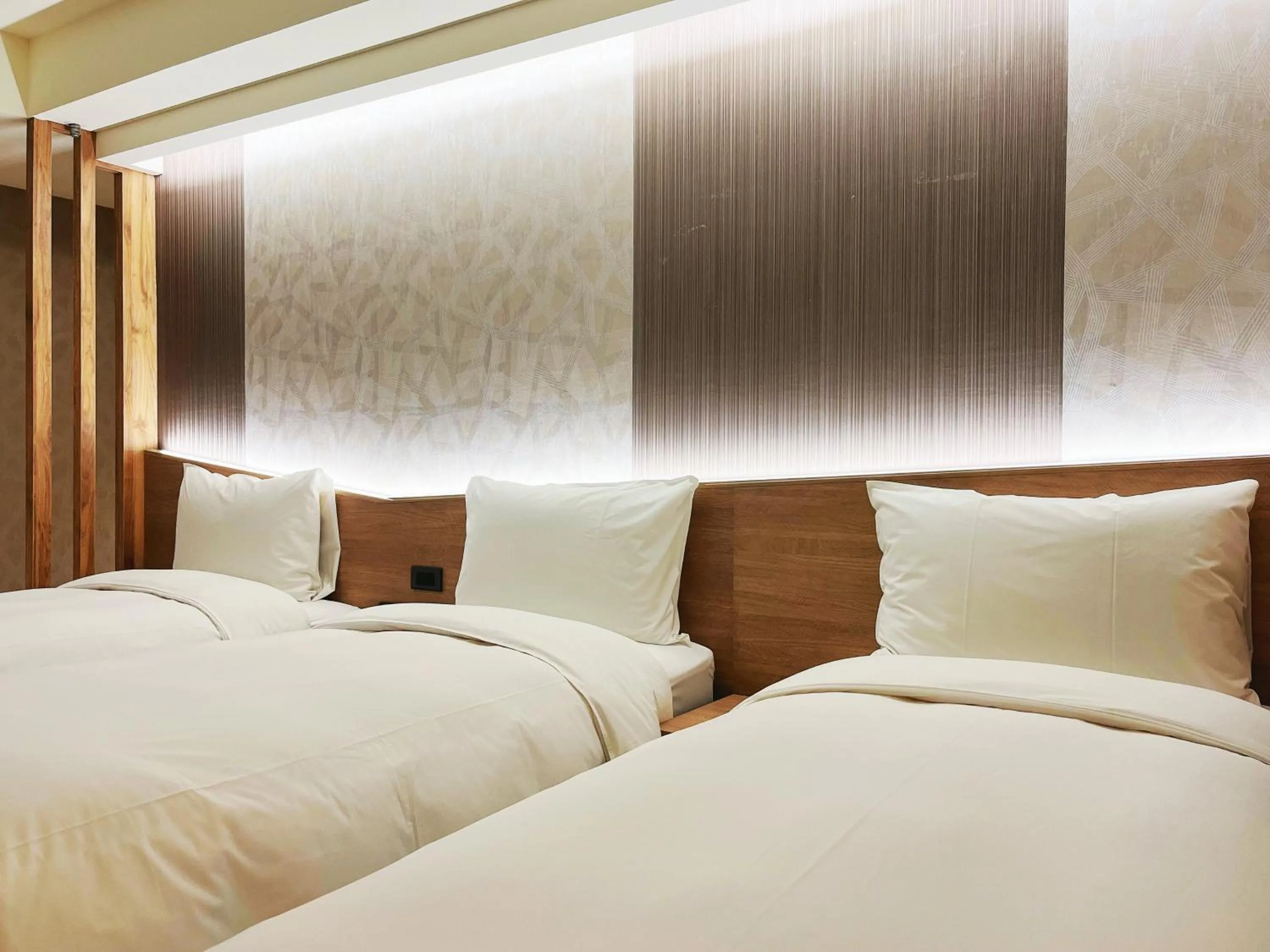 Bed in 新仕飯店-New City Hotel