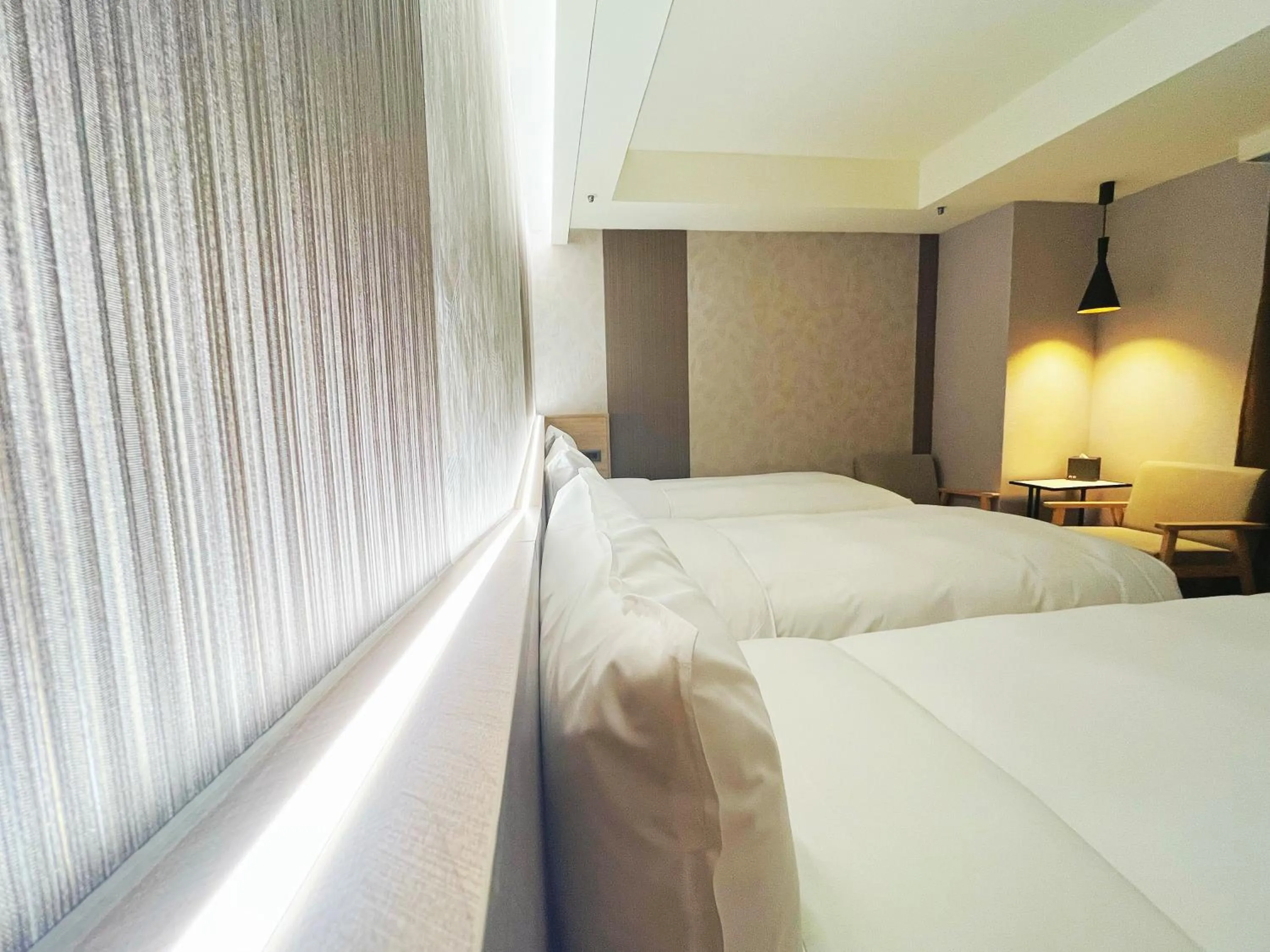 Bed in 新仕飯店-New City Hotel