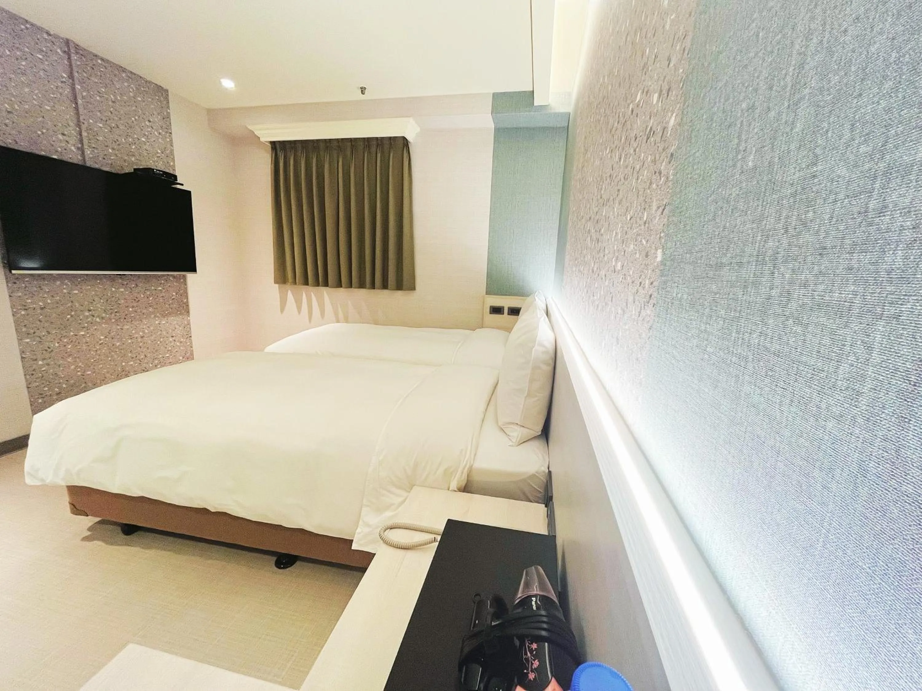 Bed in 新仕飯店-New City Hotel