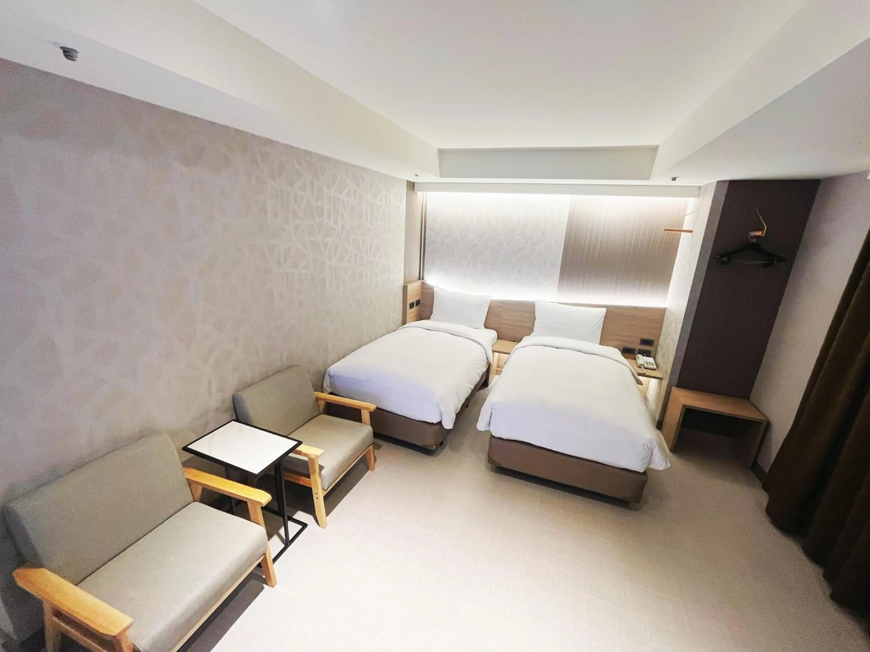 Bed in 新仕飯店-New City Hotel