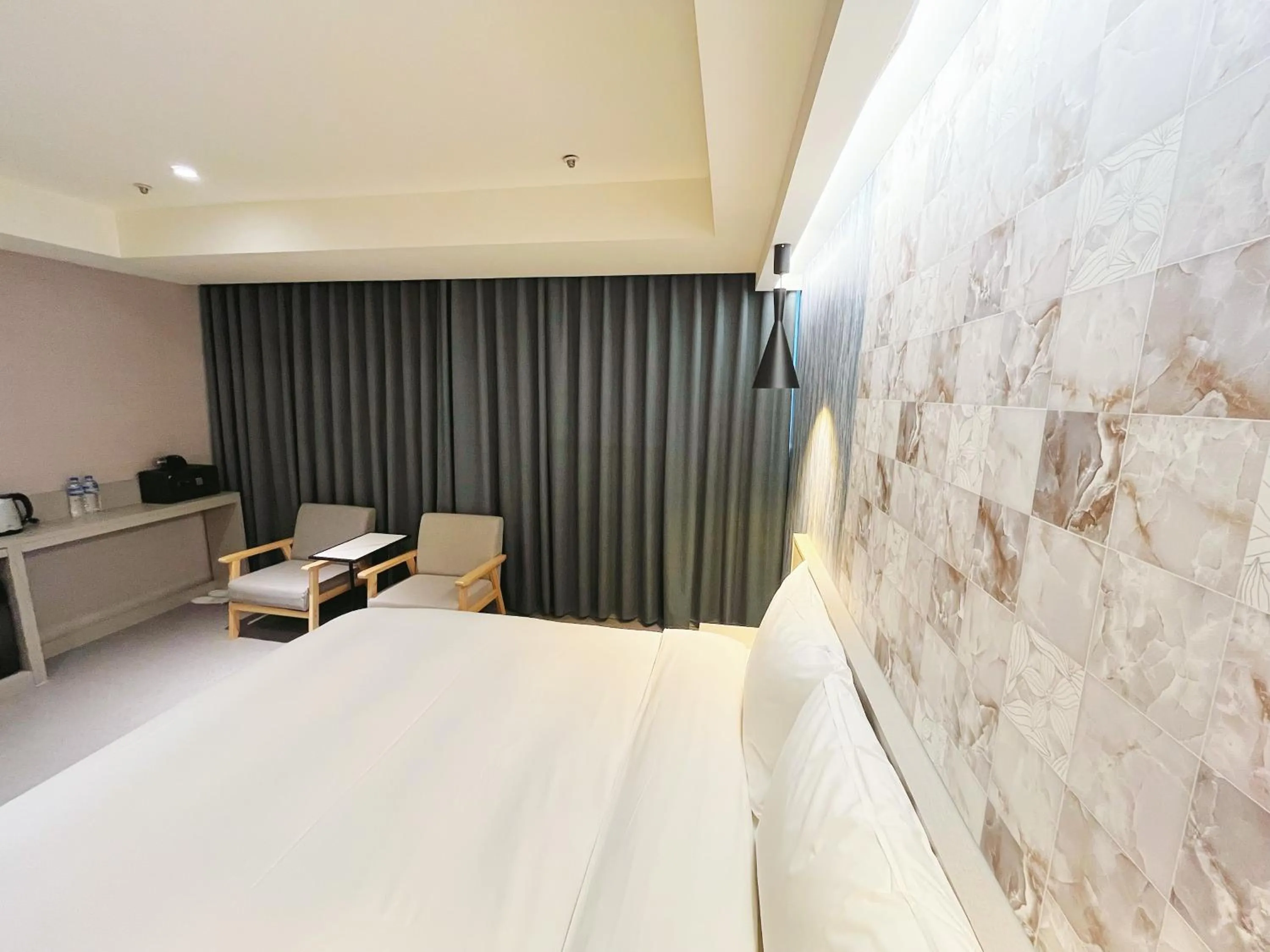 Bed in 新仕飯店-New City Hotel