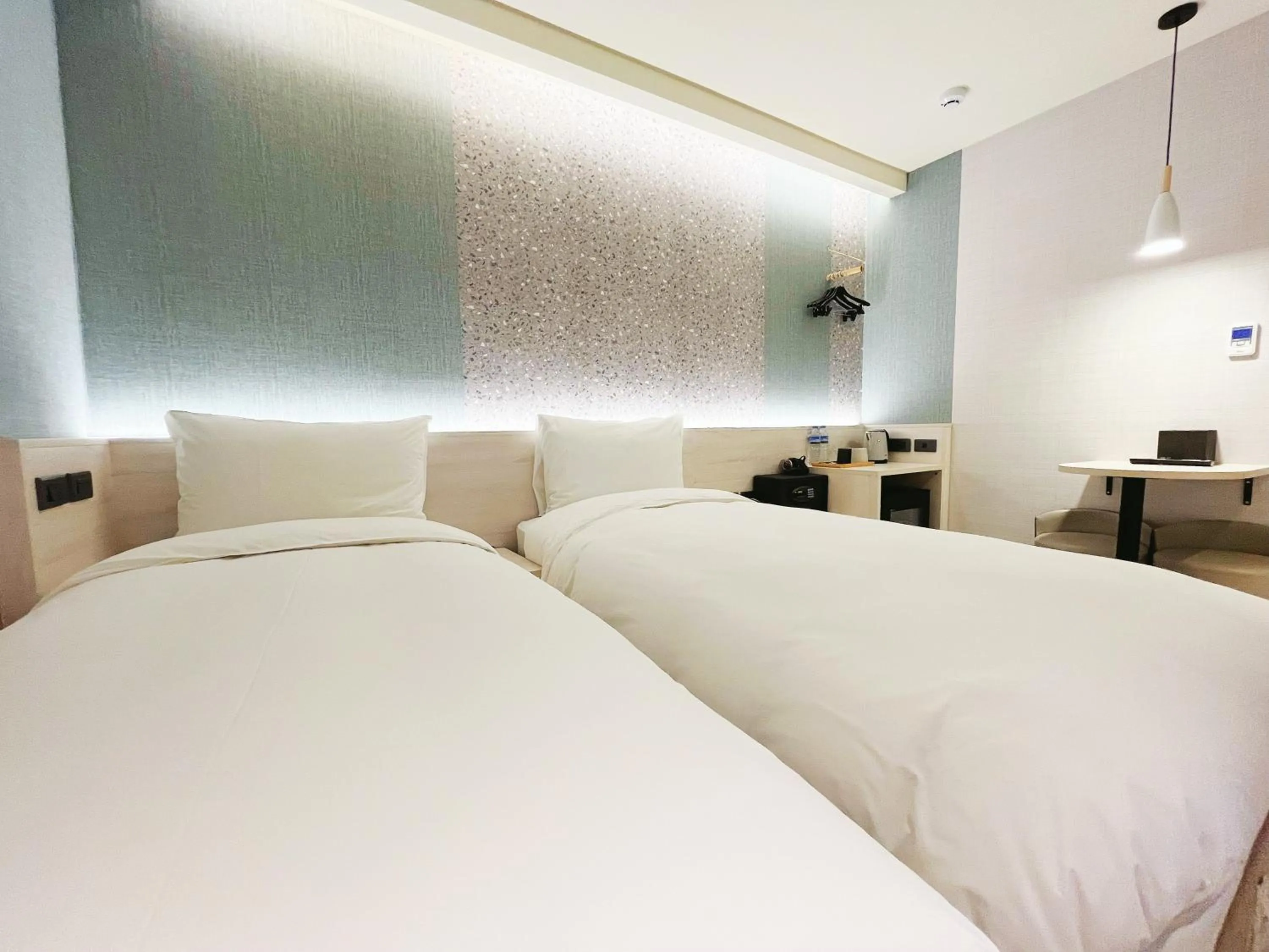 Bed in 新仕飯店-New City Hotel