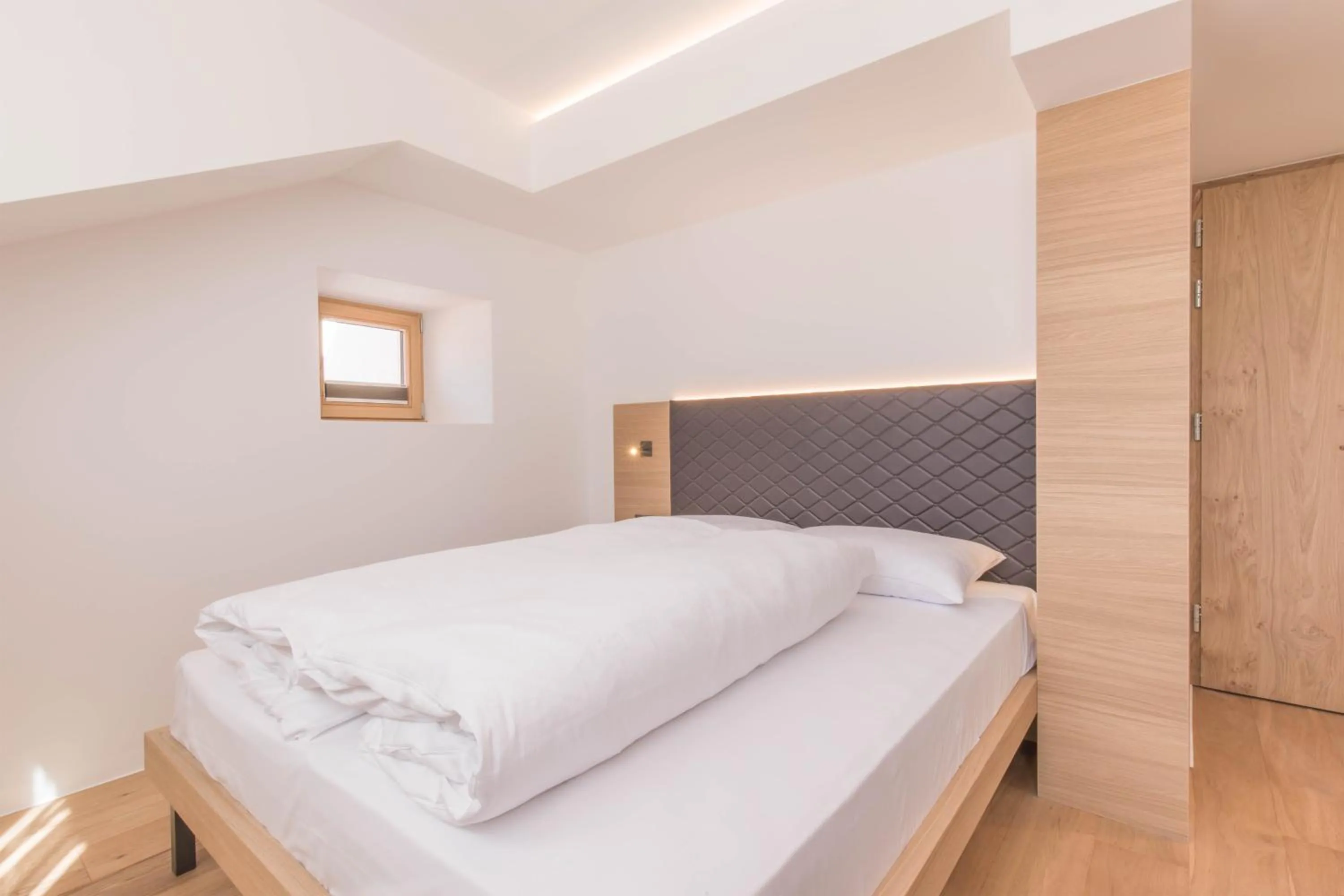 Bed in Belvenu Boutique Hotel