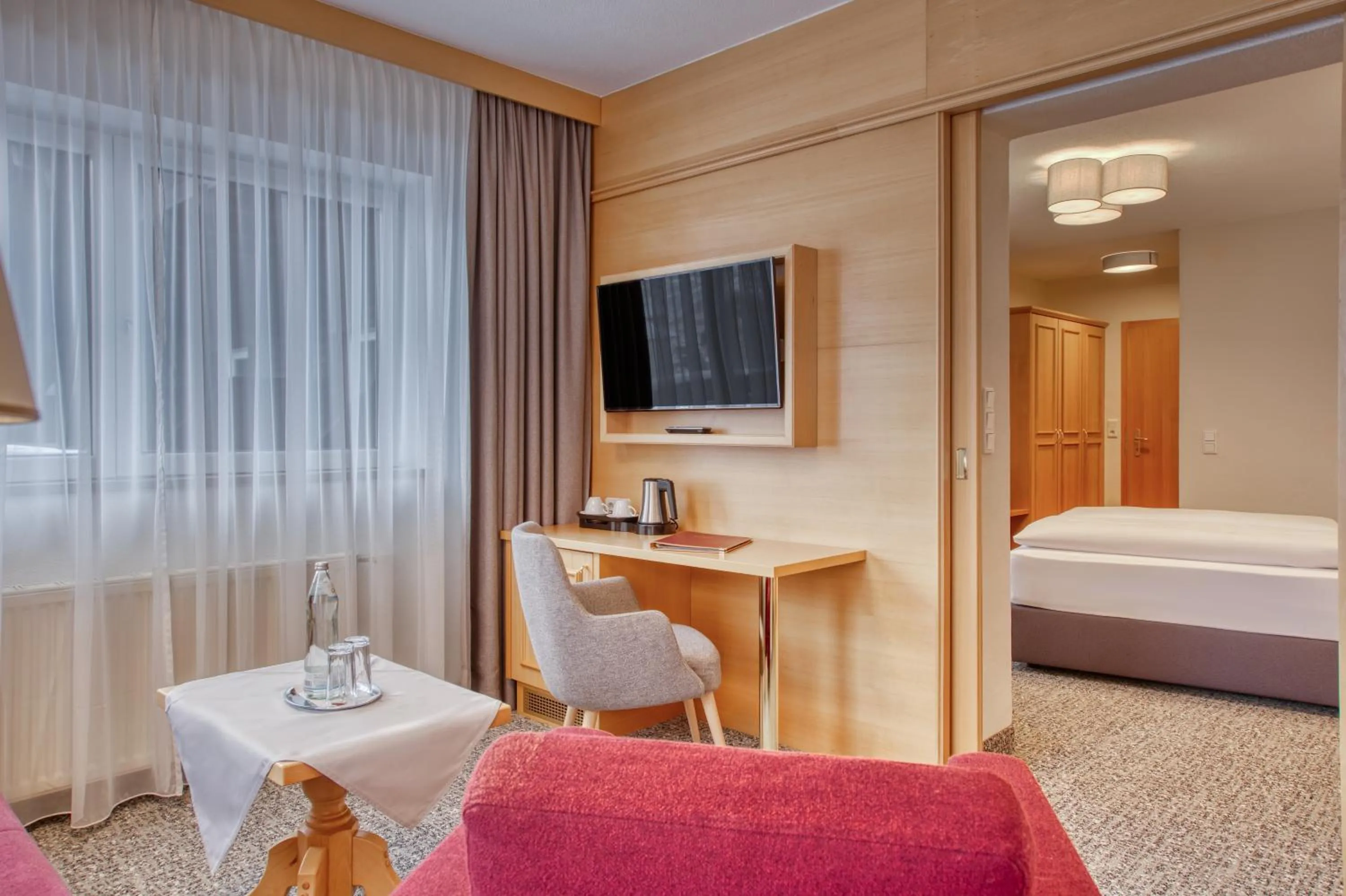 Seating area, Bed in Parkhotel Seefeld