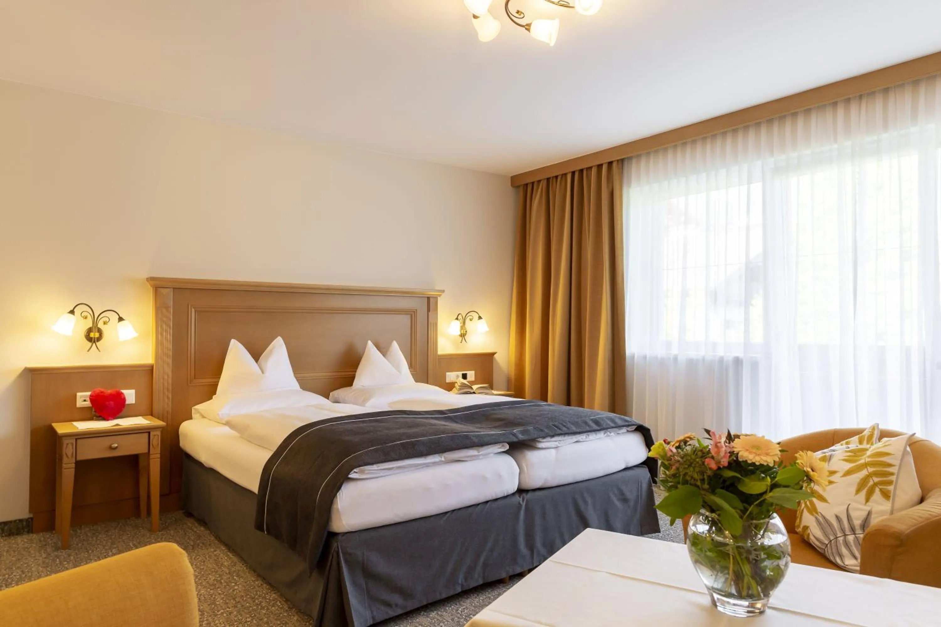 Photo of the whole room, Bed in Parkhotel Seefeld