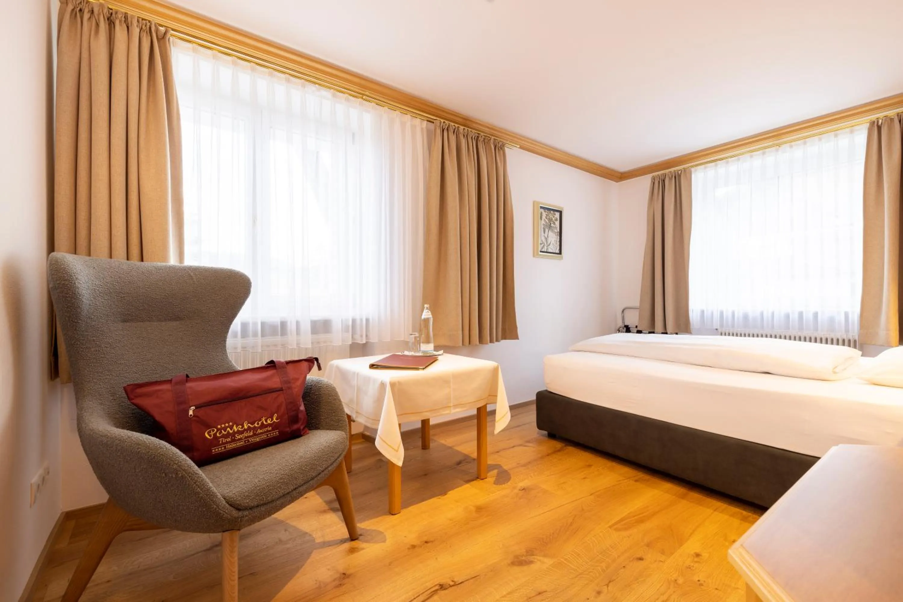 Photo of the whole room, Bed in Parkhotel Seefeld