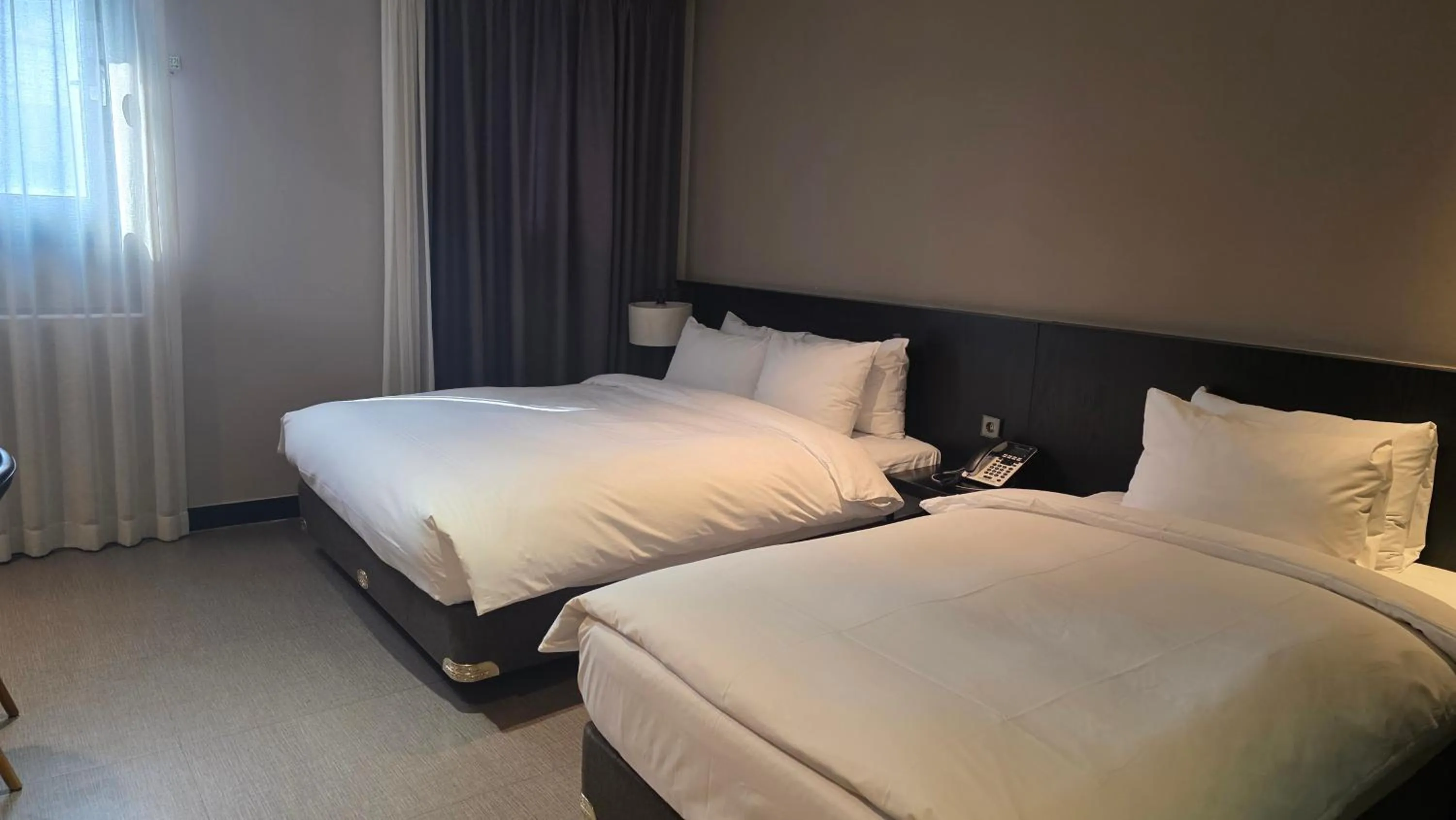 Bed in Rivertain Hotel