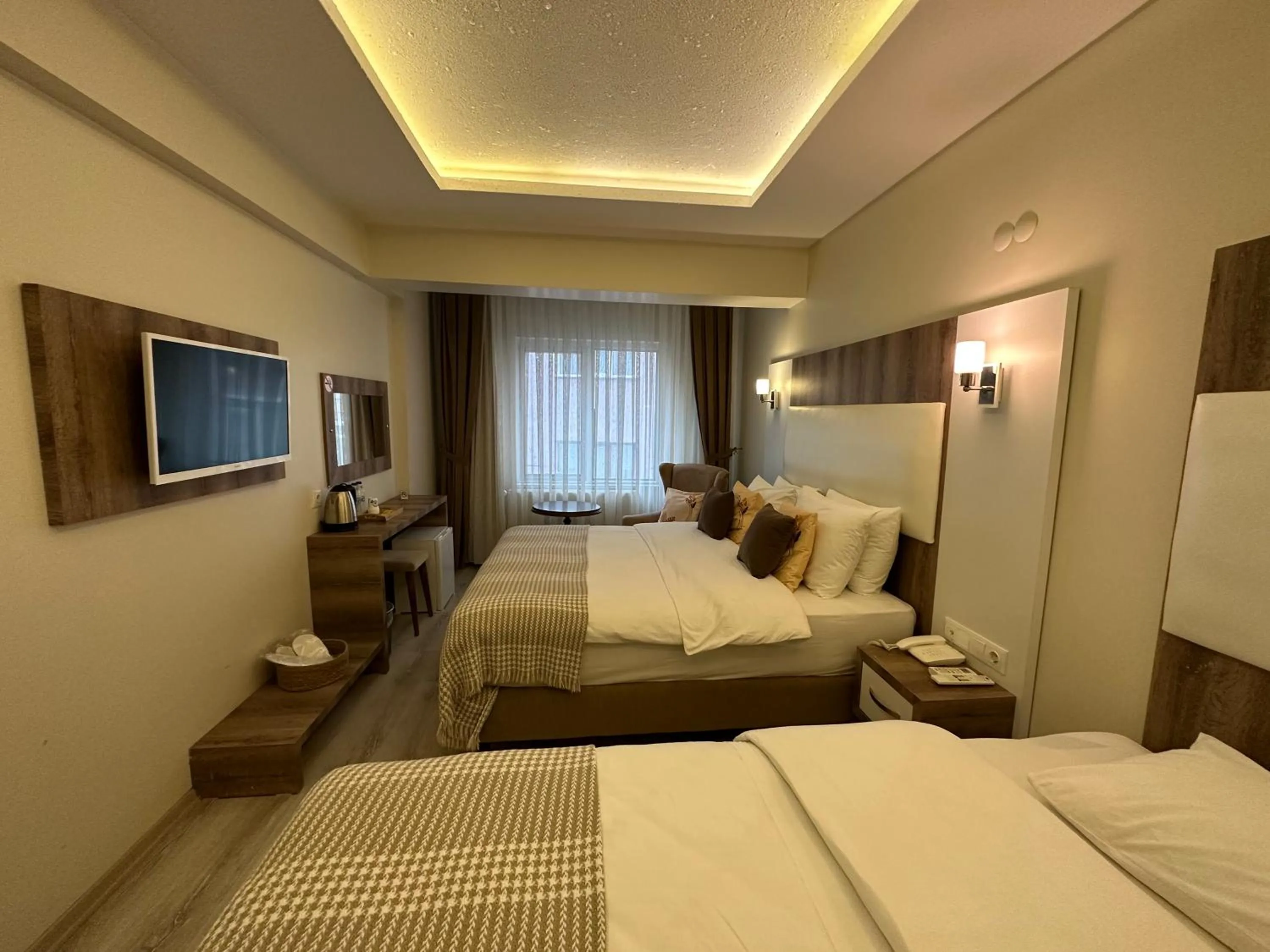 Communal lounge/ TV room, Bed in Line Suite Hotel