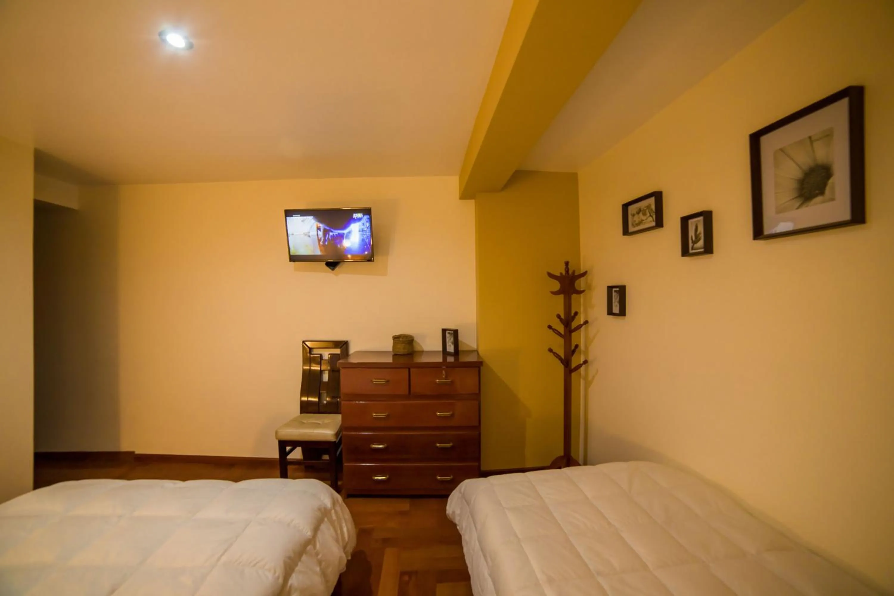 Communal lounge/ TV room, Bed in Cozy Room Cusco
