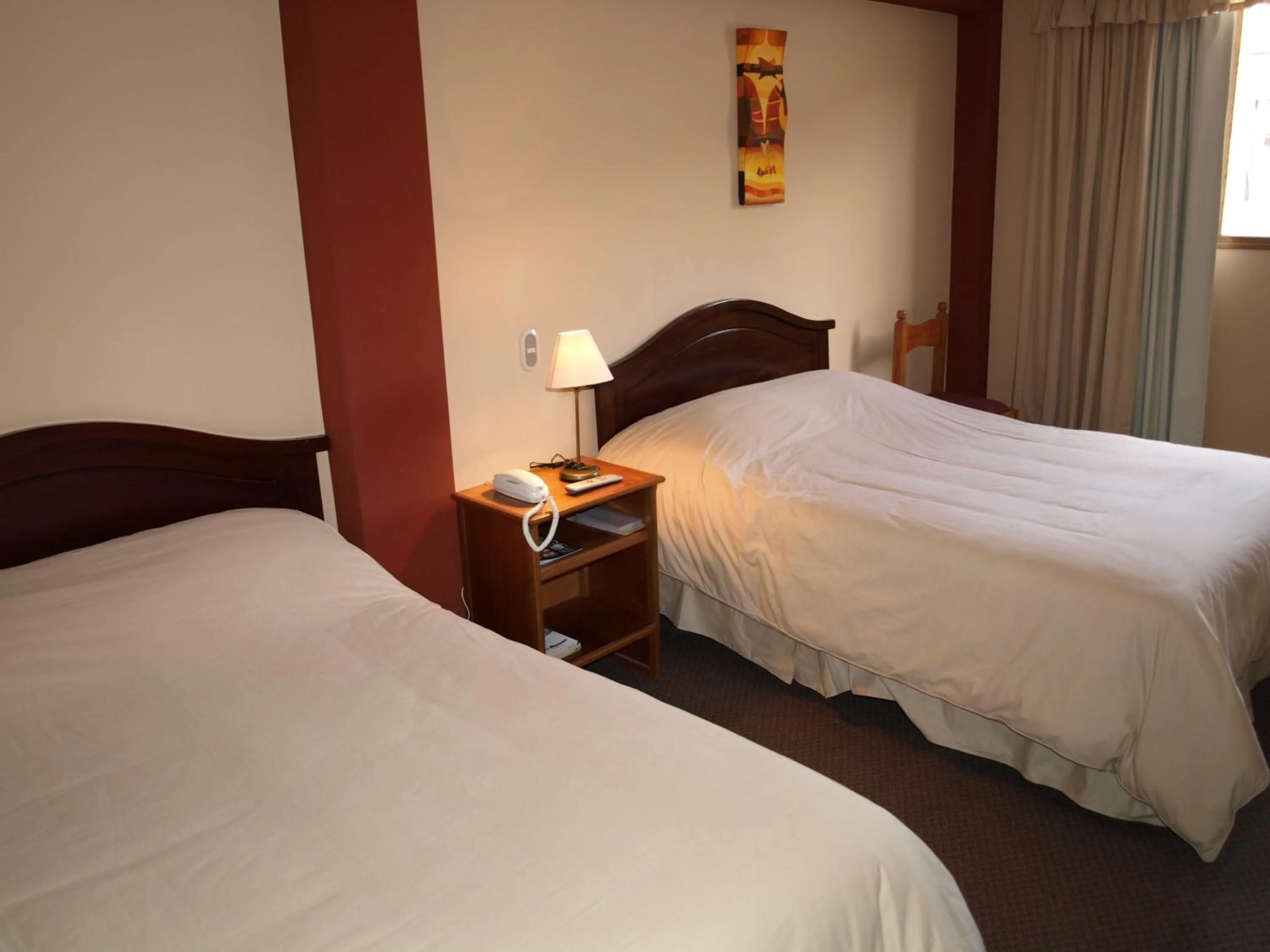 Bed in Qelqatani Hotel