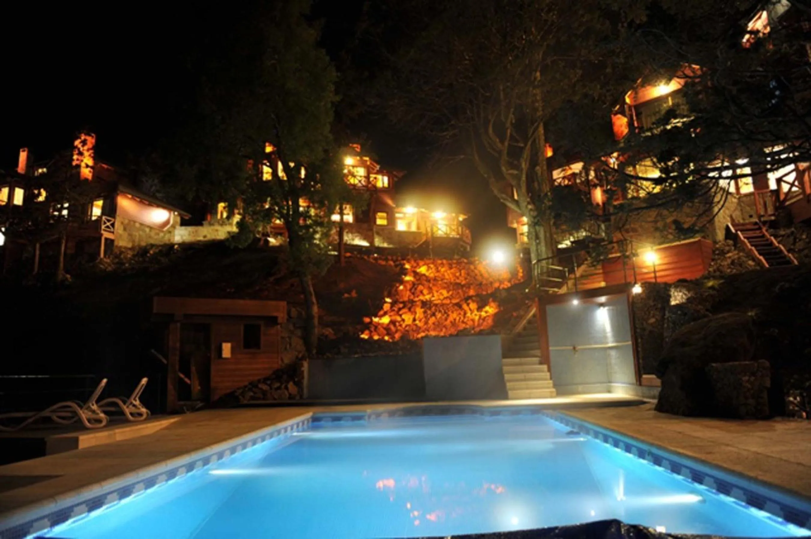 Swimming pool in Charming Luxury Lodge & Private Spa