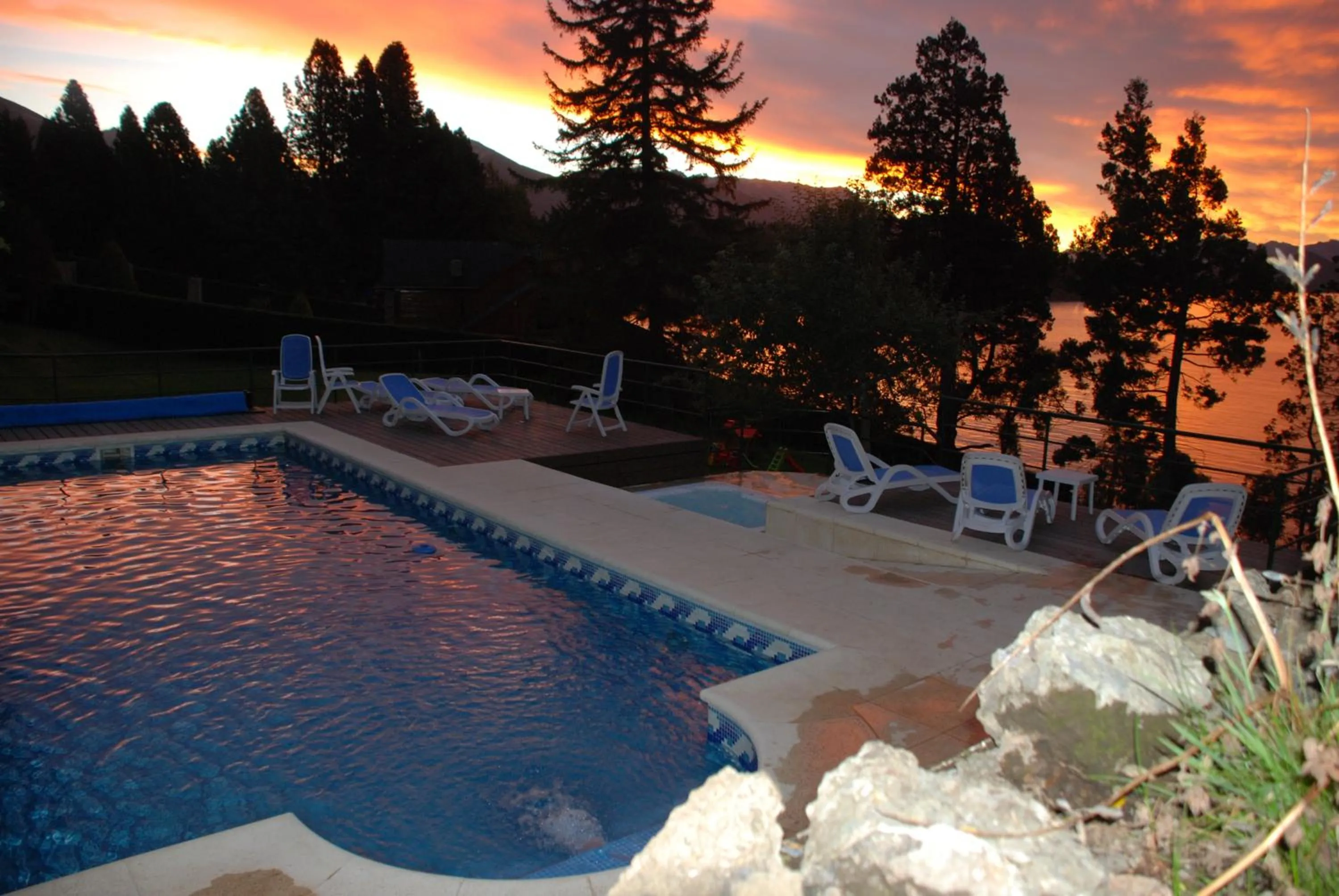 Swimming pool in Charming Luxury Lodge & Private Spa