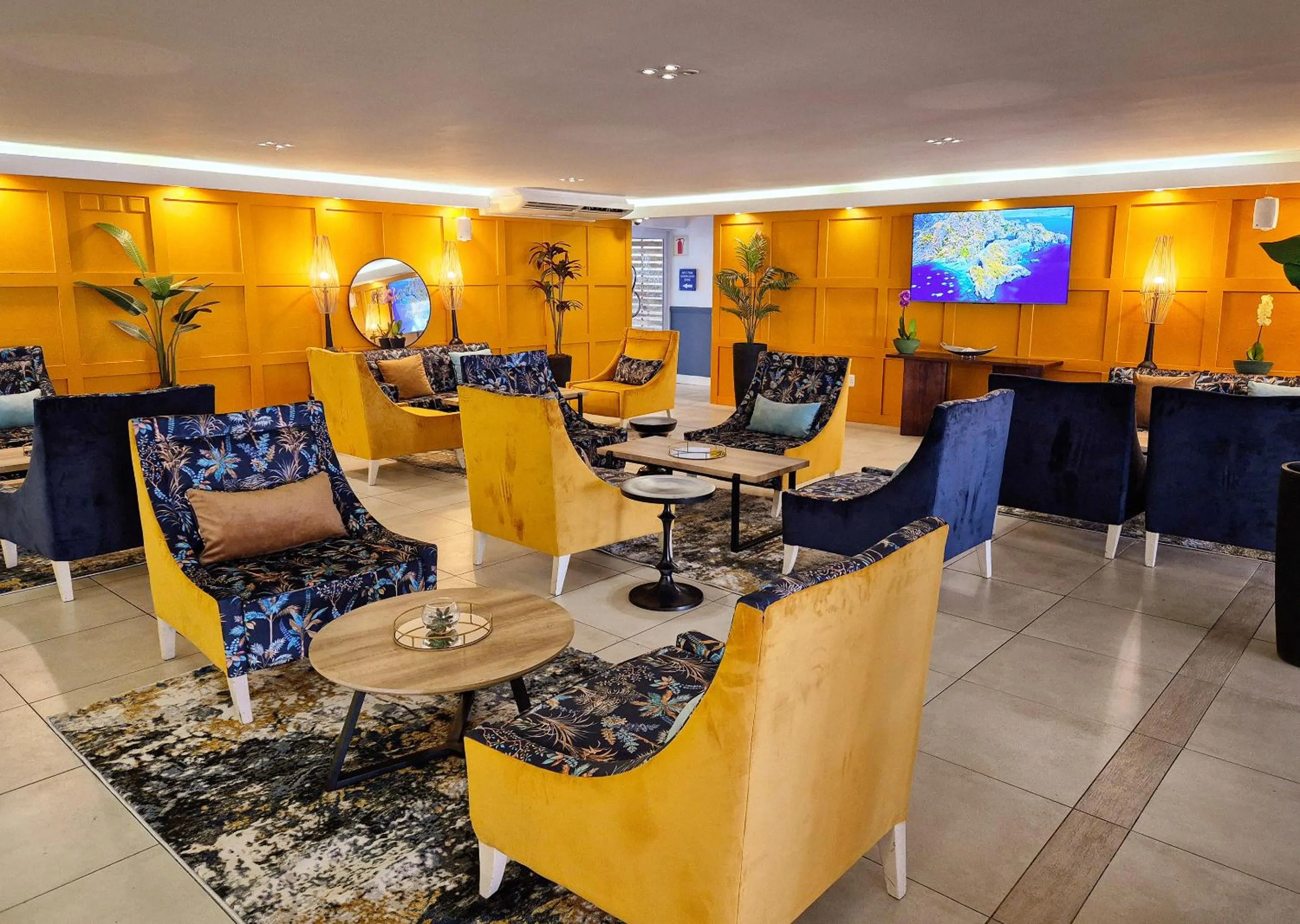Communal lounge/ TV room in Blue Marlin All-Inclusive Seascape by Dream Resorts