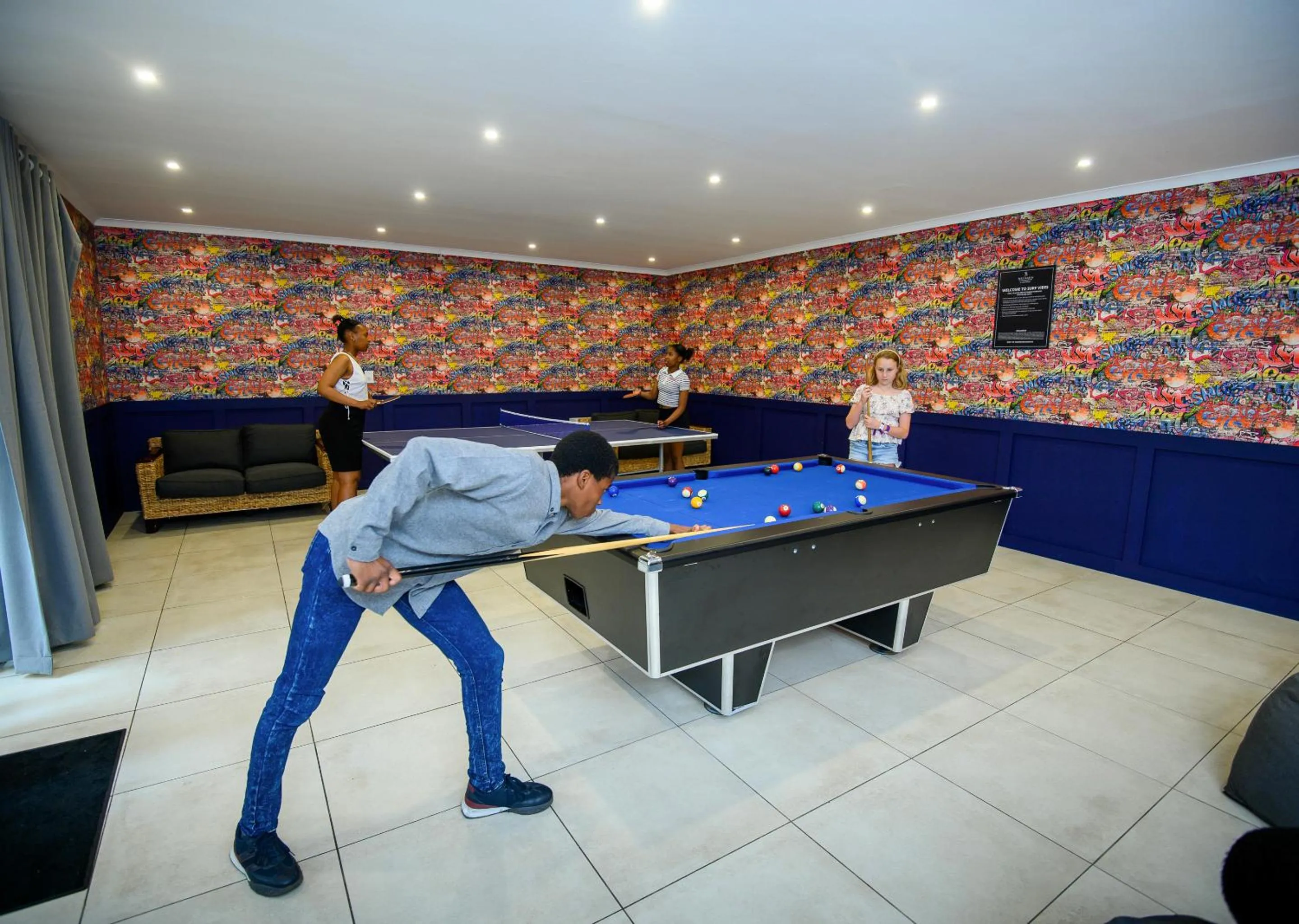 Communal lounge/ TV room in Blue Marlin All-Inclusive Seascape by Dream Resorts