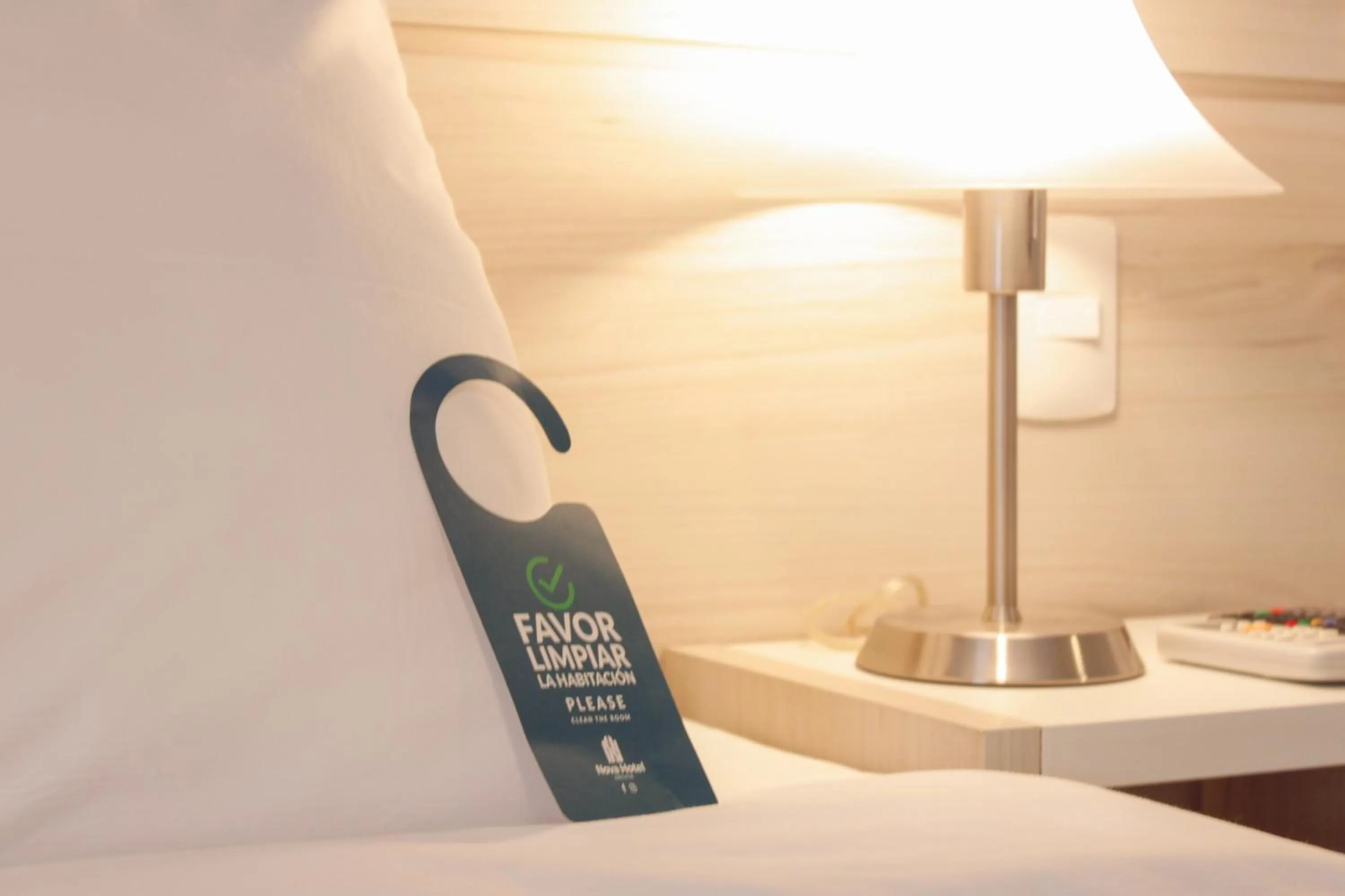 Property logo or sign, Bed in Nova Hotel