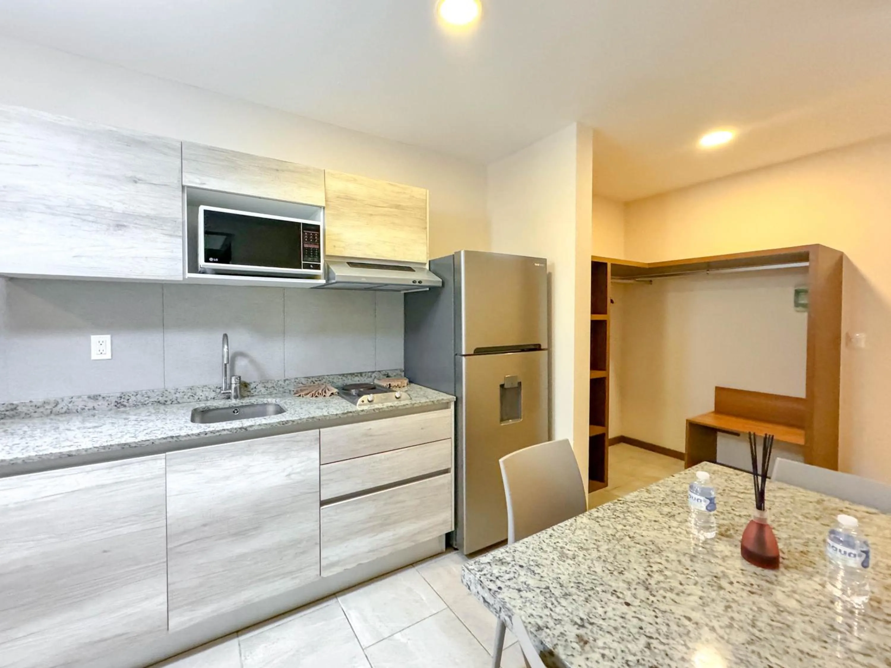 Kitchen or kitchenette in Grand Fifty Suites