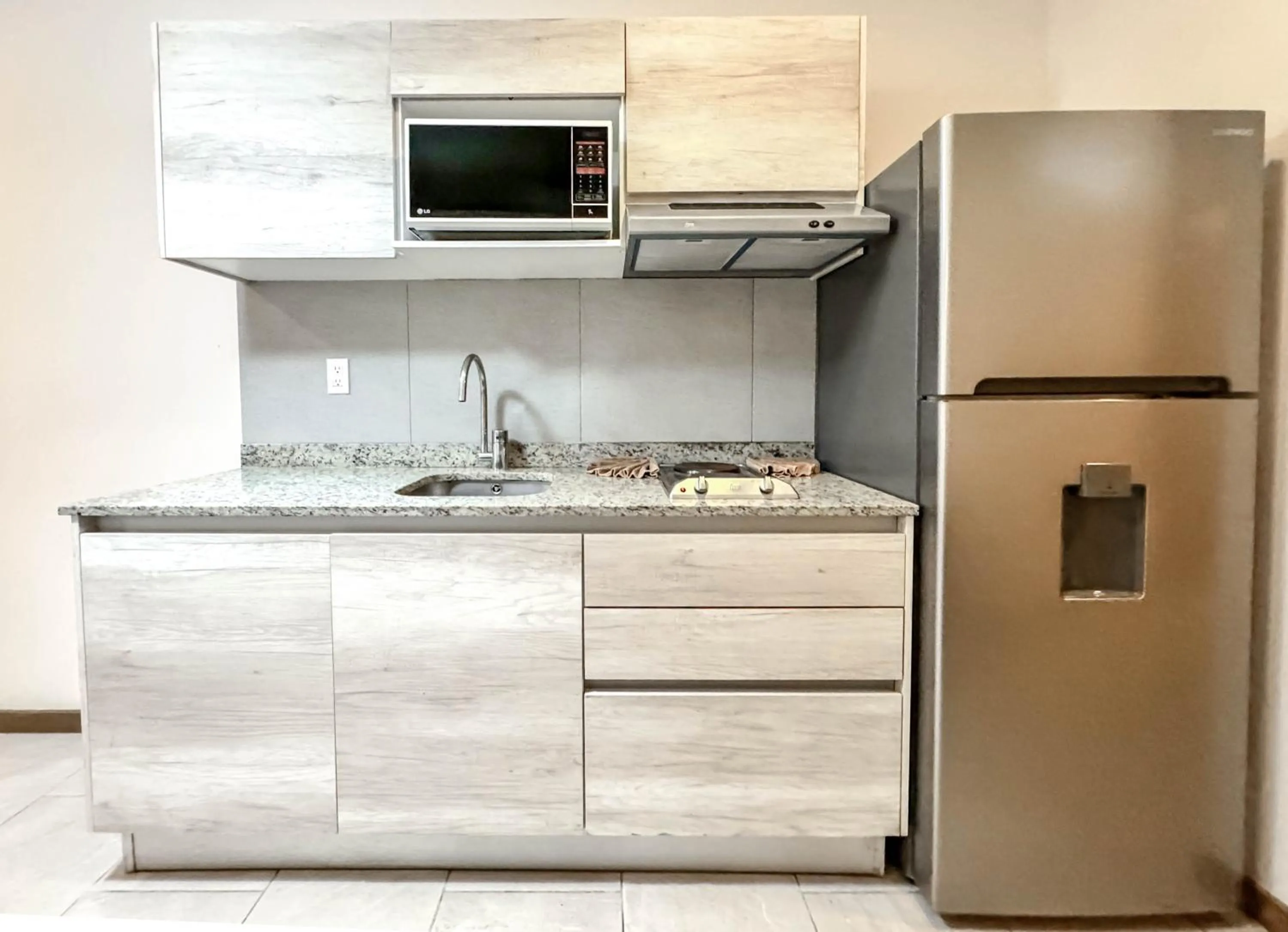 Kitchen or kitchenette in Grand Fifty Suites