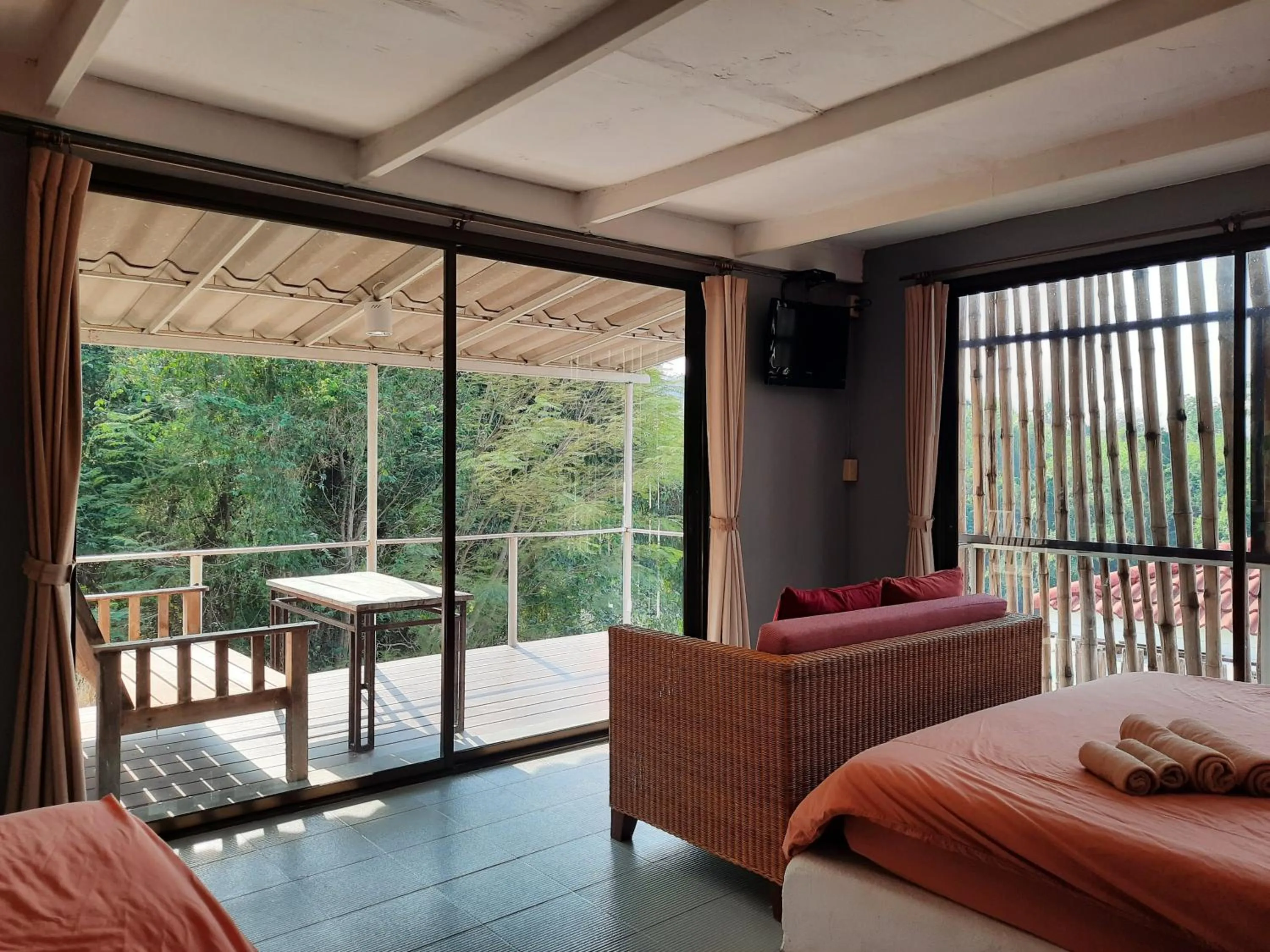 Bed in Chasorn Riverside Resort