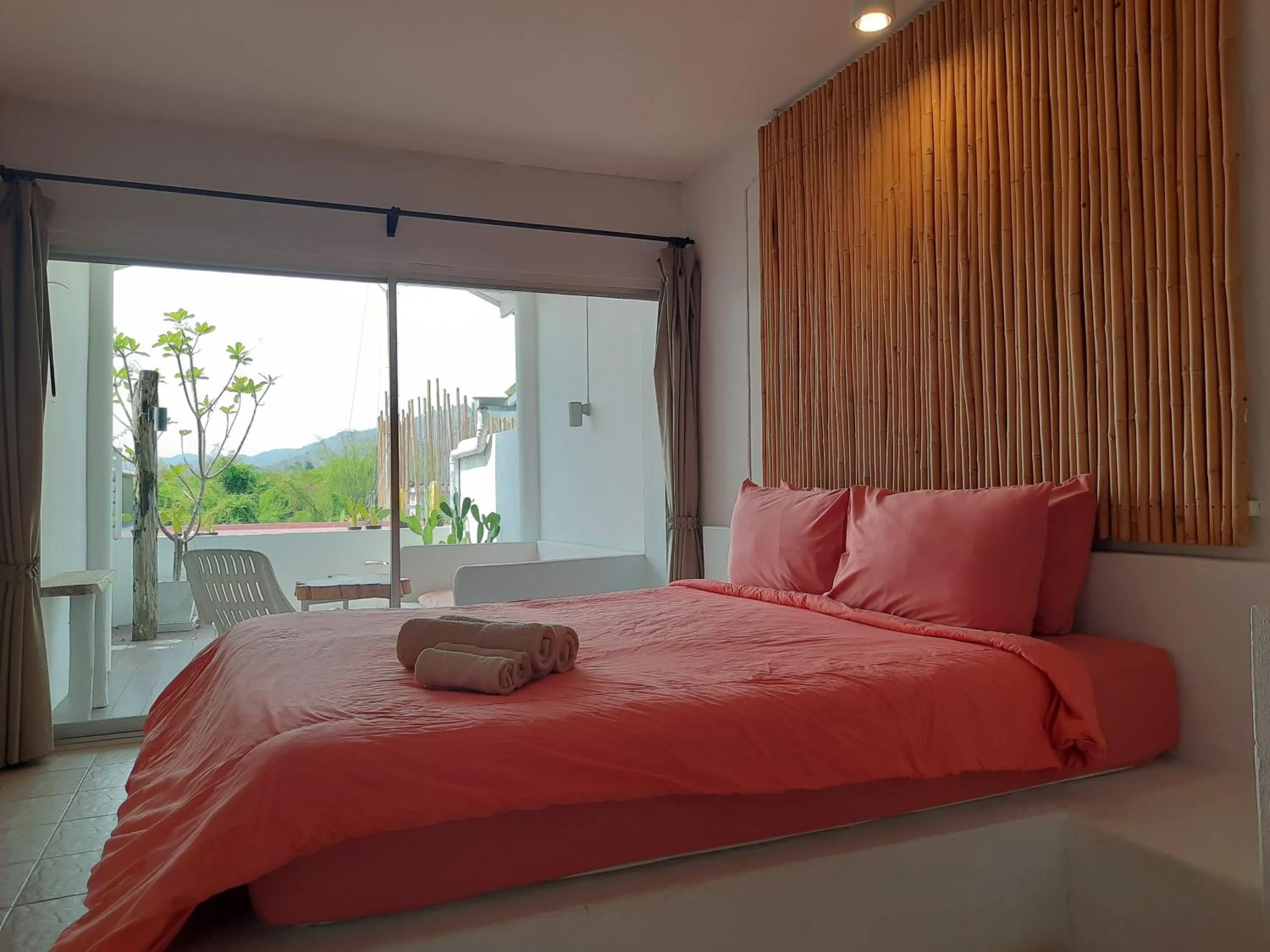 Bed in Chasorn Riverside Resort