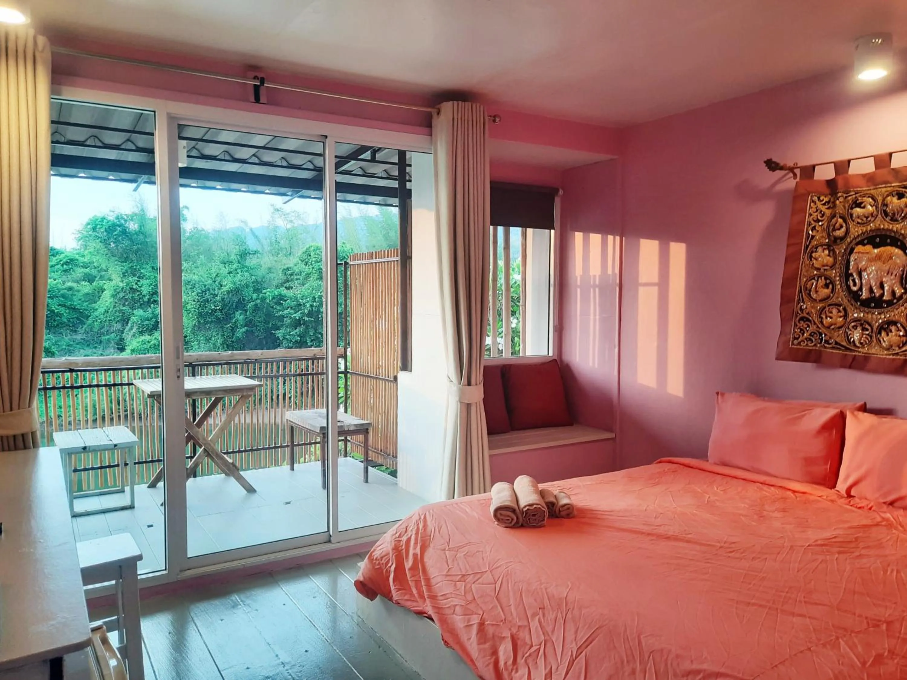 Bed in Chasorn Riverside Resort