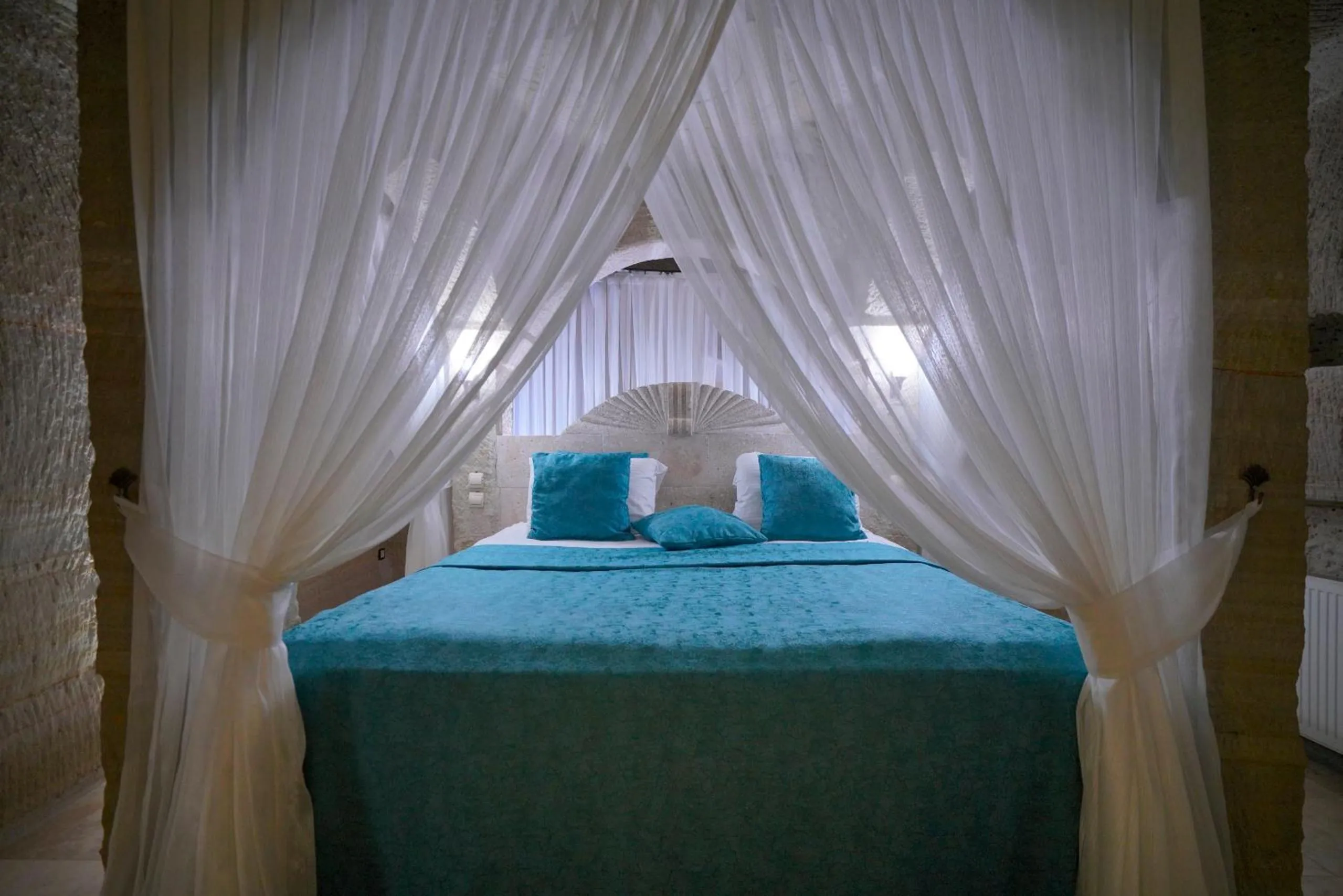 Bed in Holiday Cave Hotel