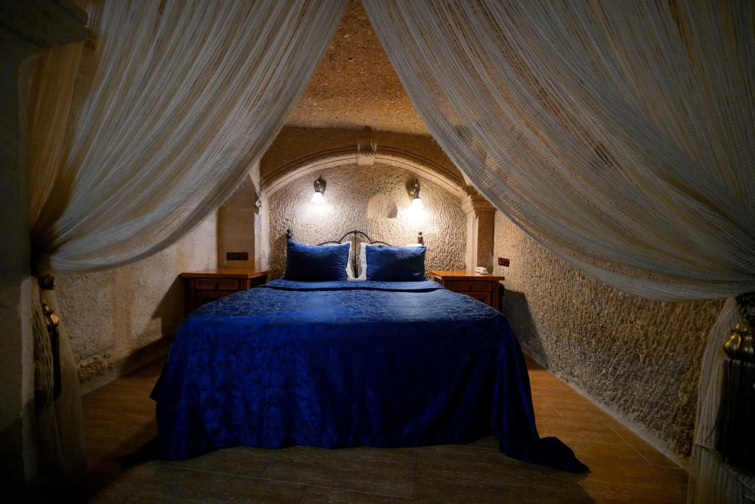 Bed in Holiday Cave Hotel