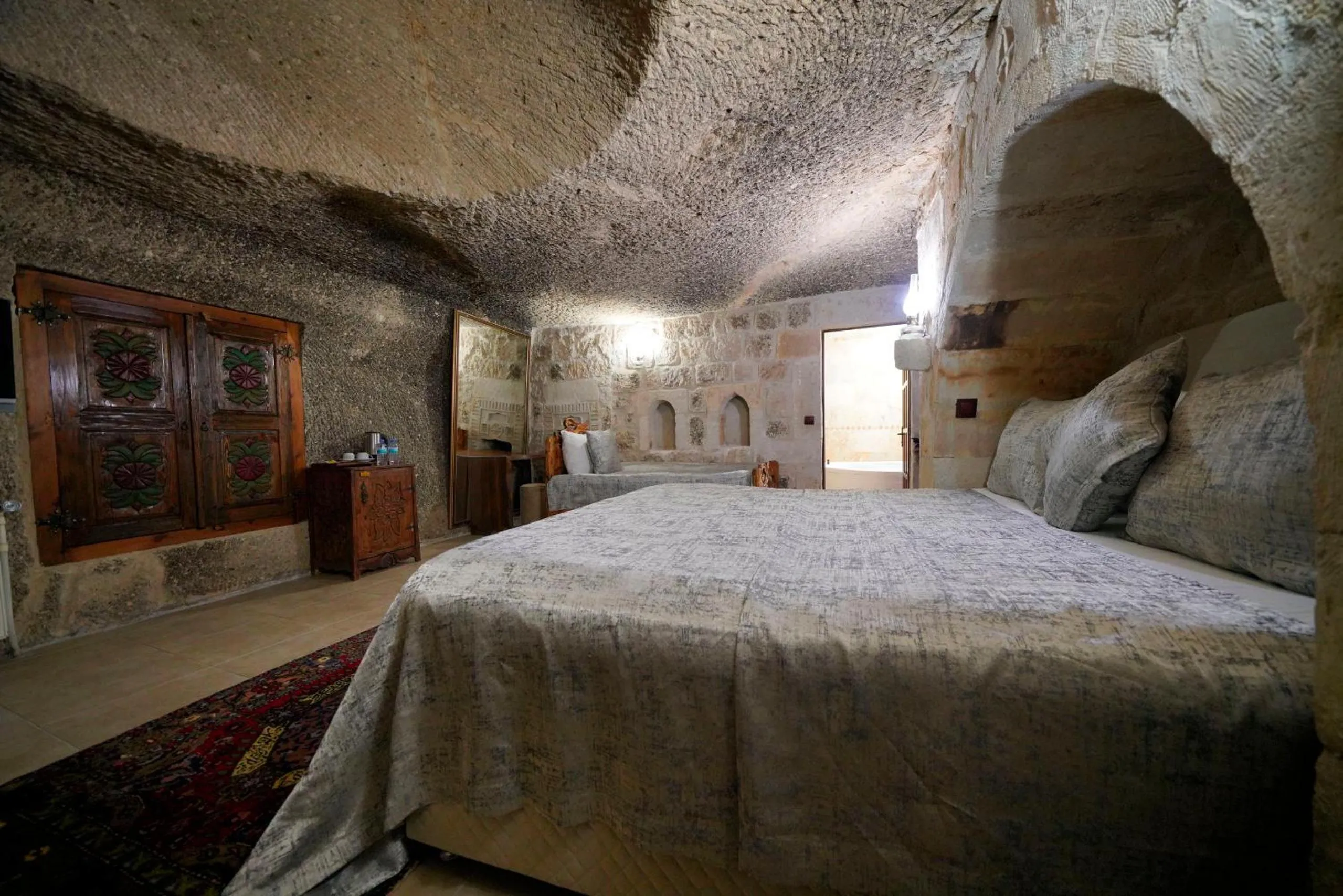 Bed in Holiday Cave Hotel