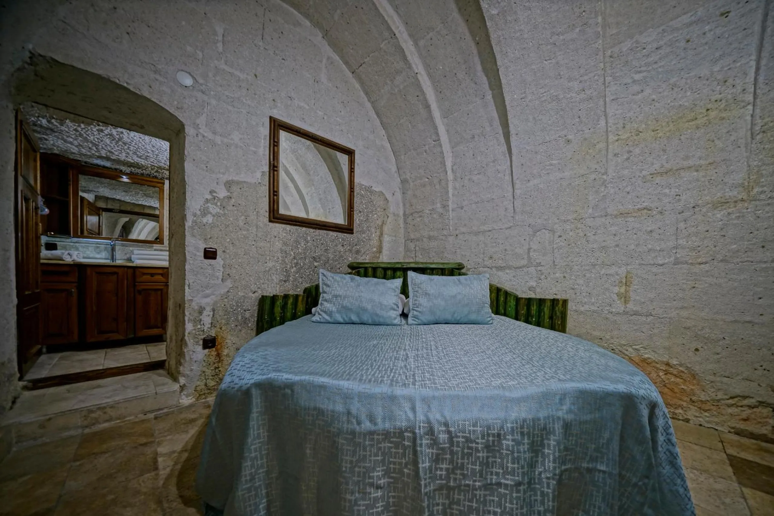 Bed in Holiday Cave Hotel