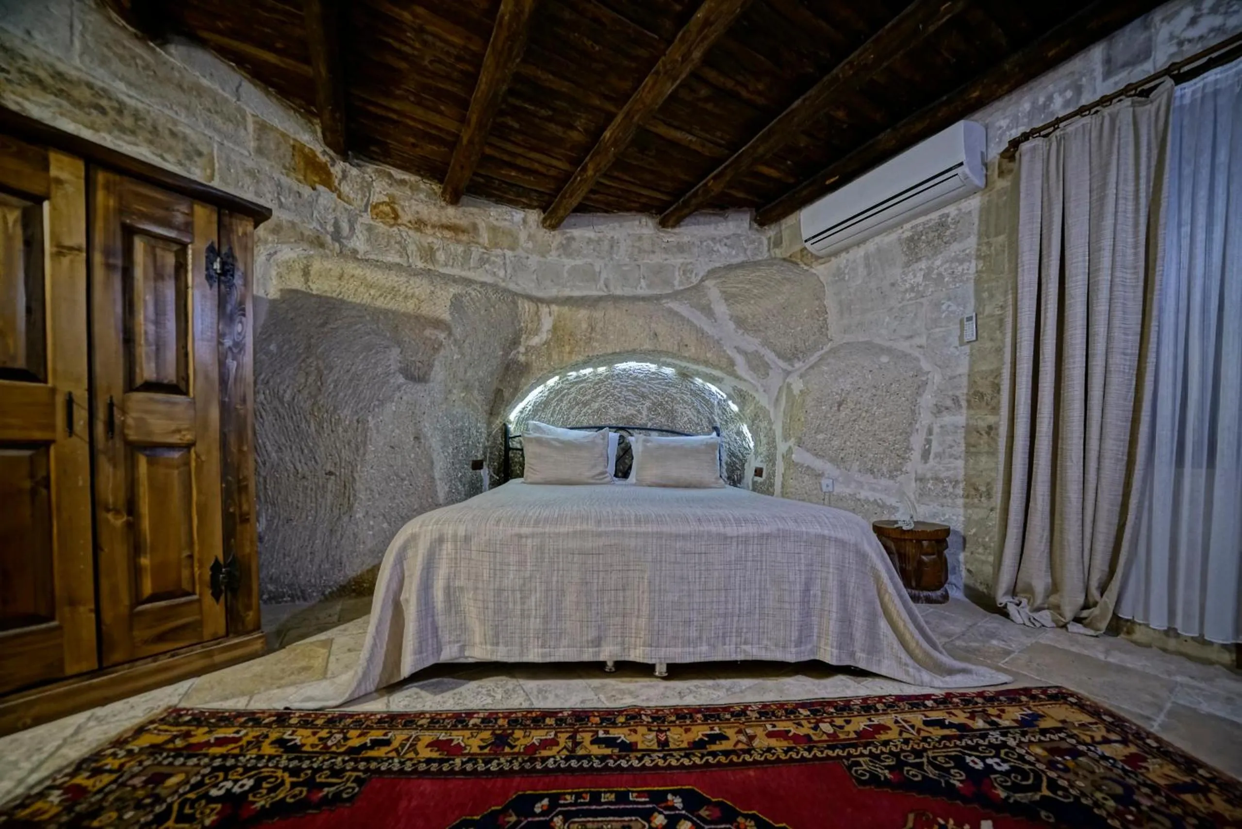 Bed in Holiday Cave Hotel