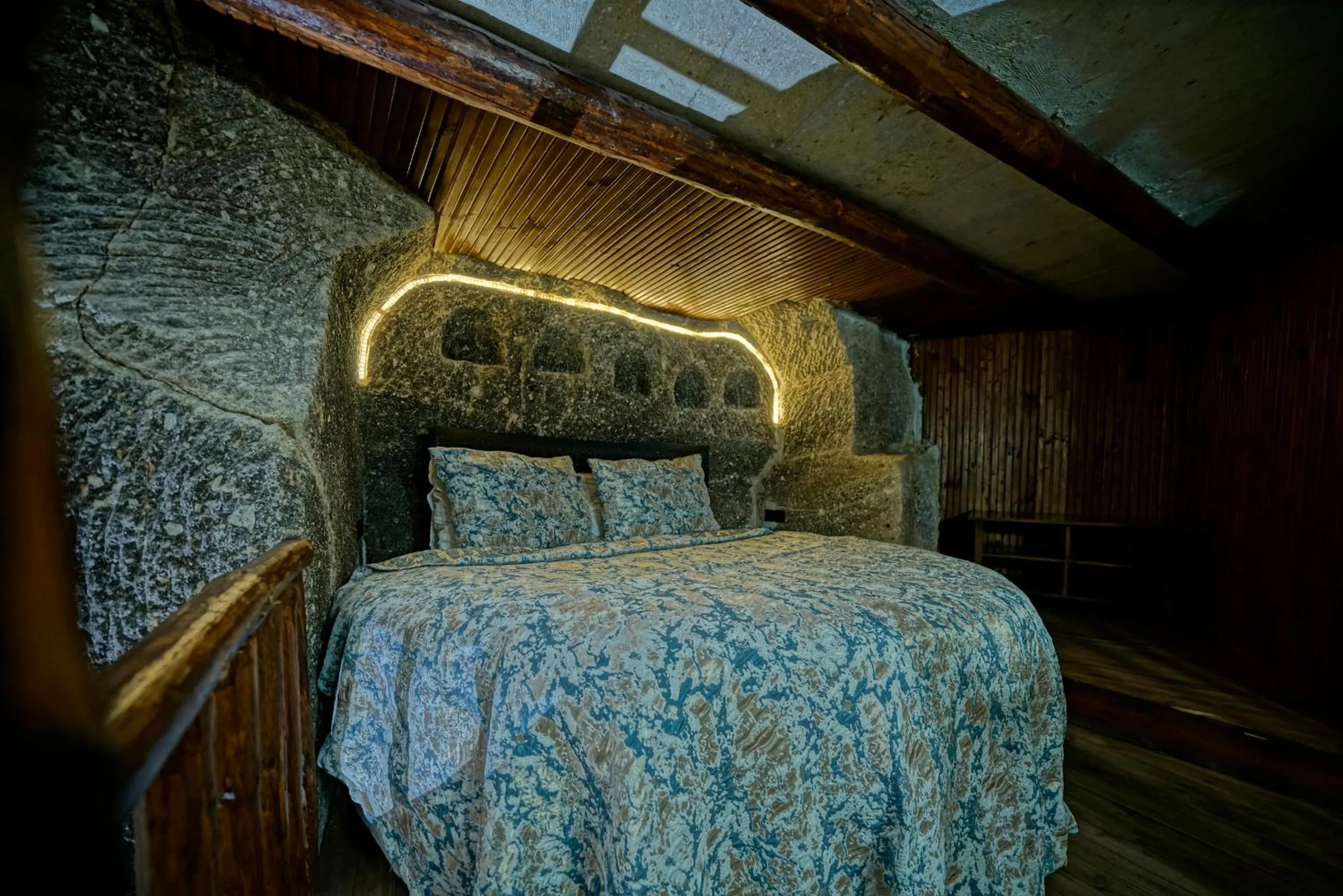 Bed in Holiday Cave Hotel