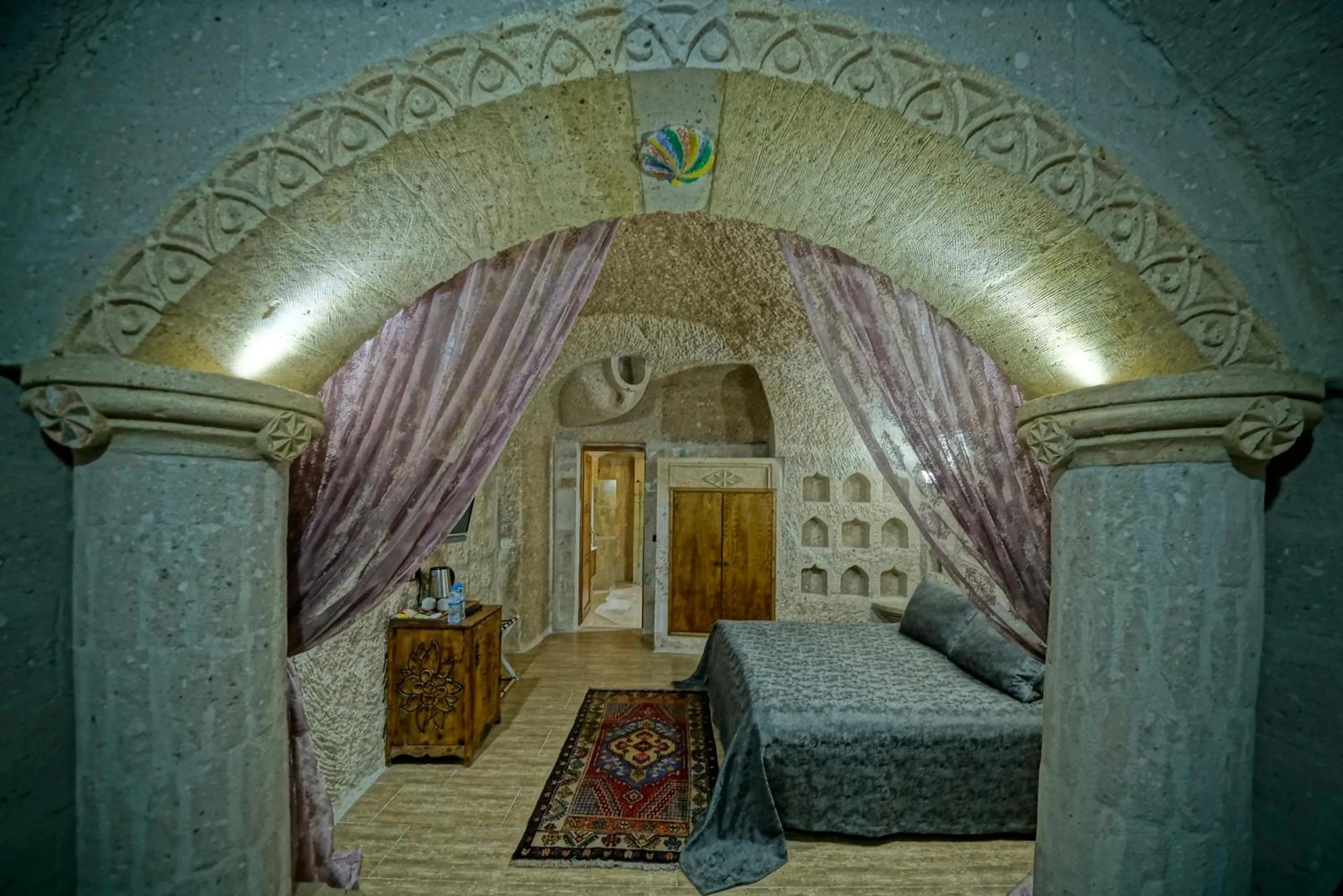 Bed in Holiday Cave Hotel