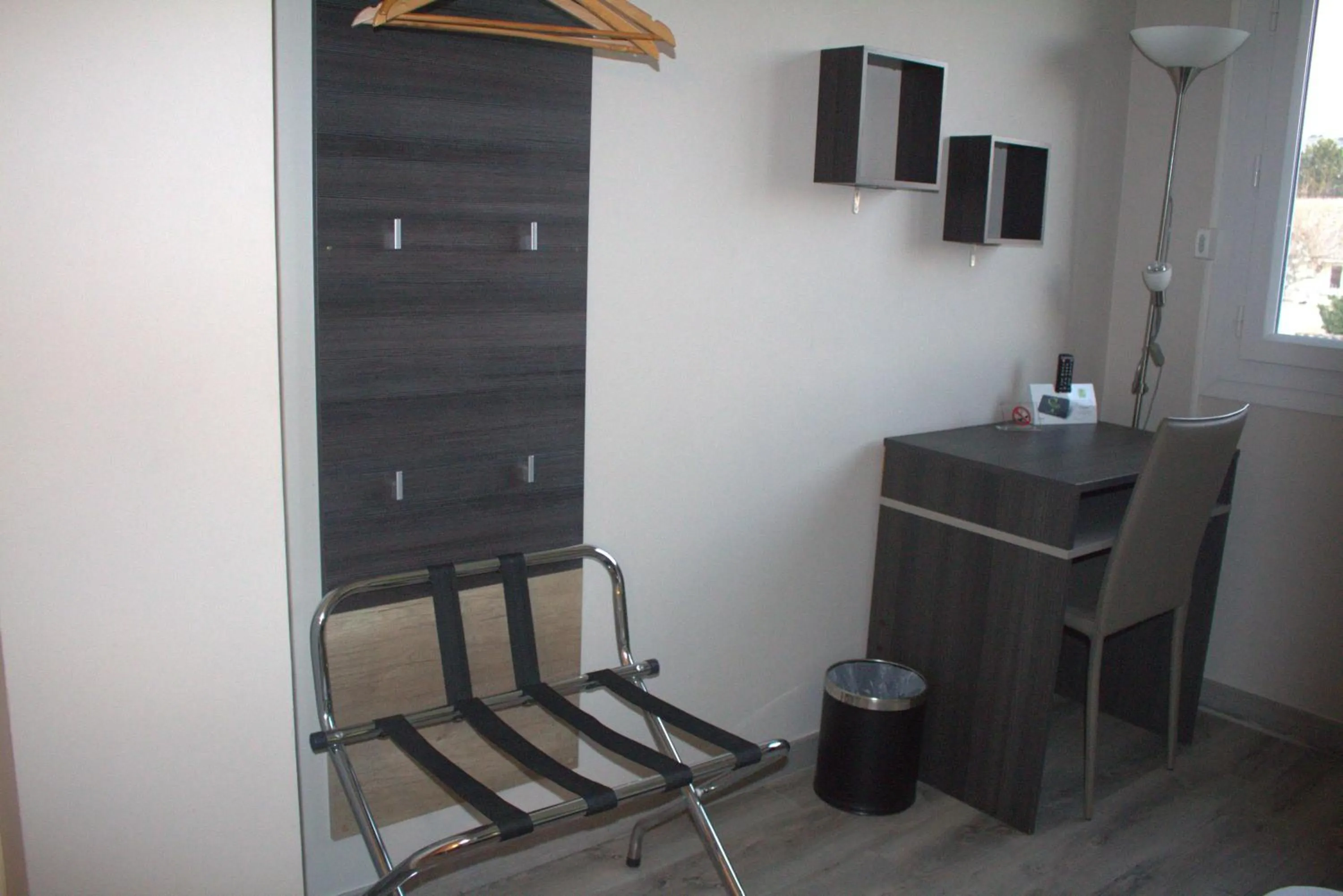 Seating area in Logis Hôtel Le Clement V