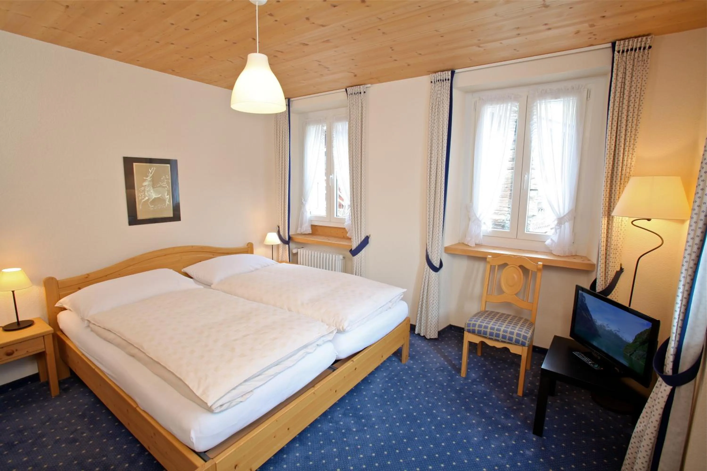 Bed in Hôtel du Cerf