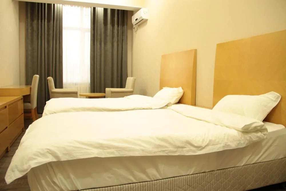 Bed in Sunrise Apartments