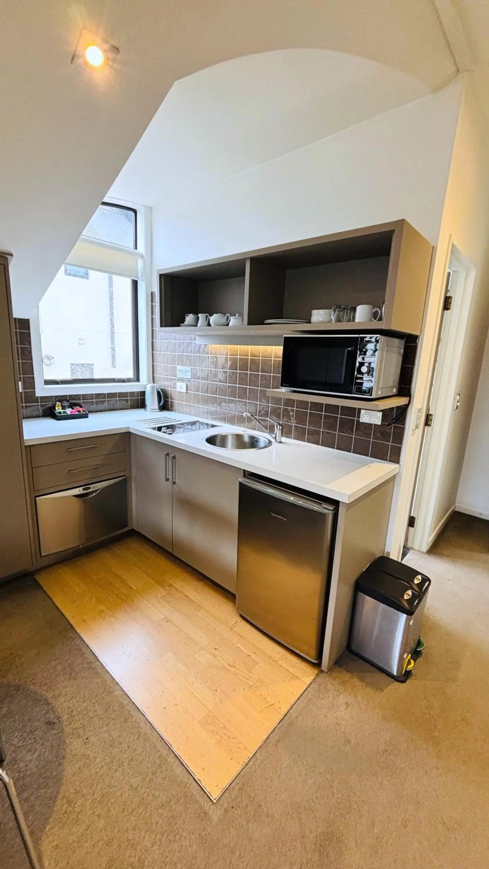 Kitchen or kitchenette in Garden Court Suites & Apartments
