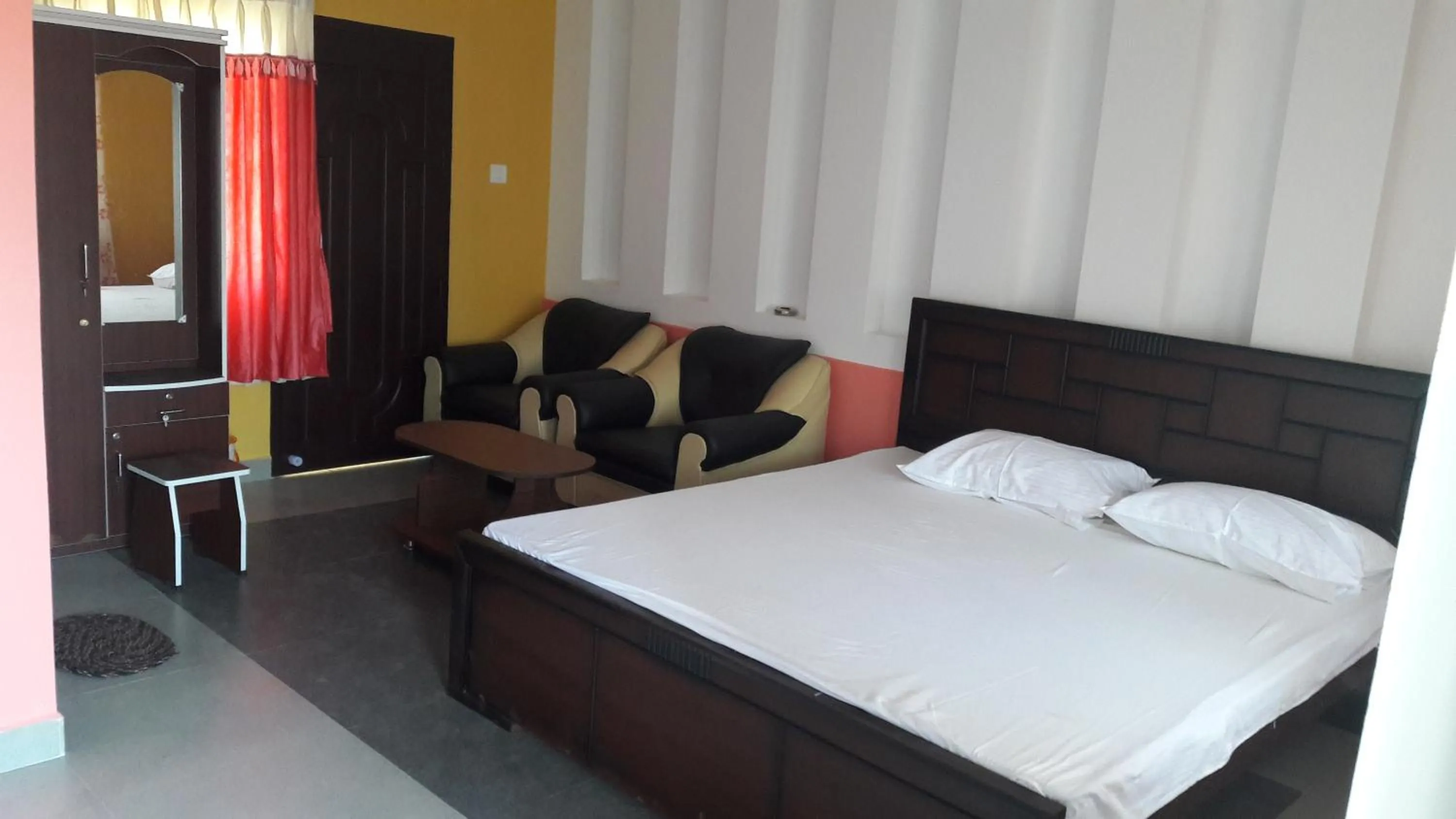 Bed in KBS Sree Paradise Kodai