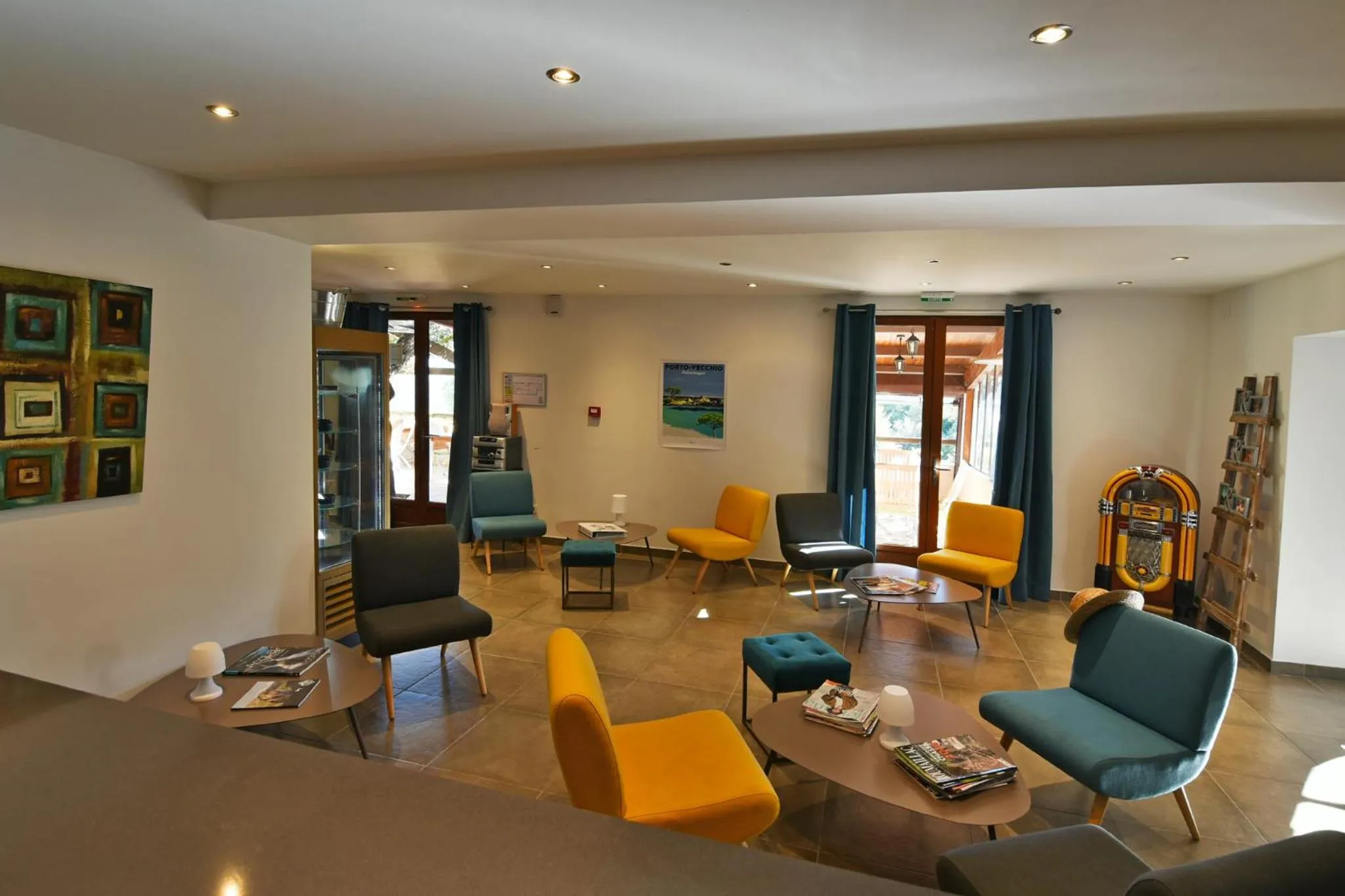 Communal lounge/ TV room in Bungalows Du Maquis