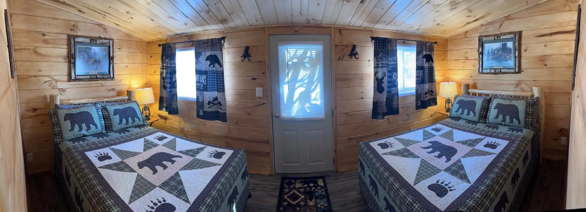 Bed in Rowe's Adirondack Cabins of Schroon Lake