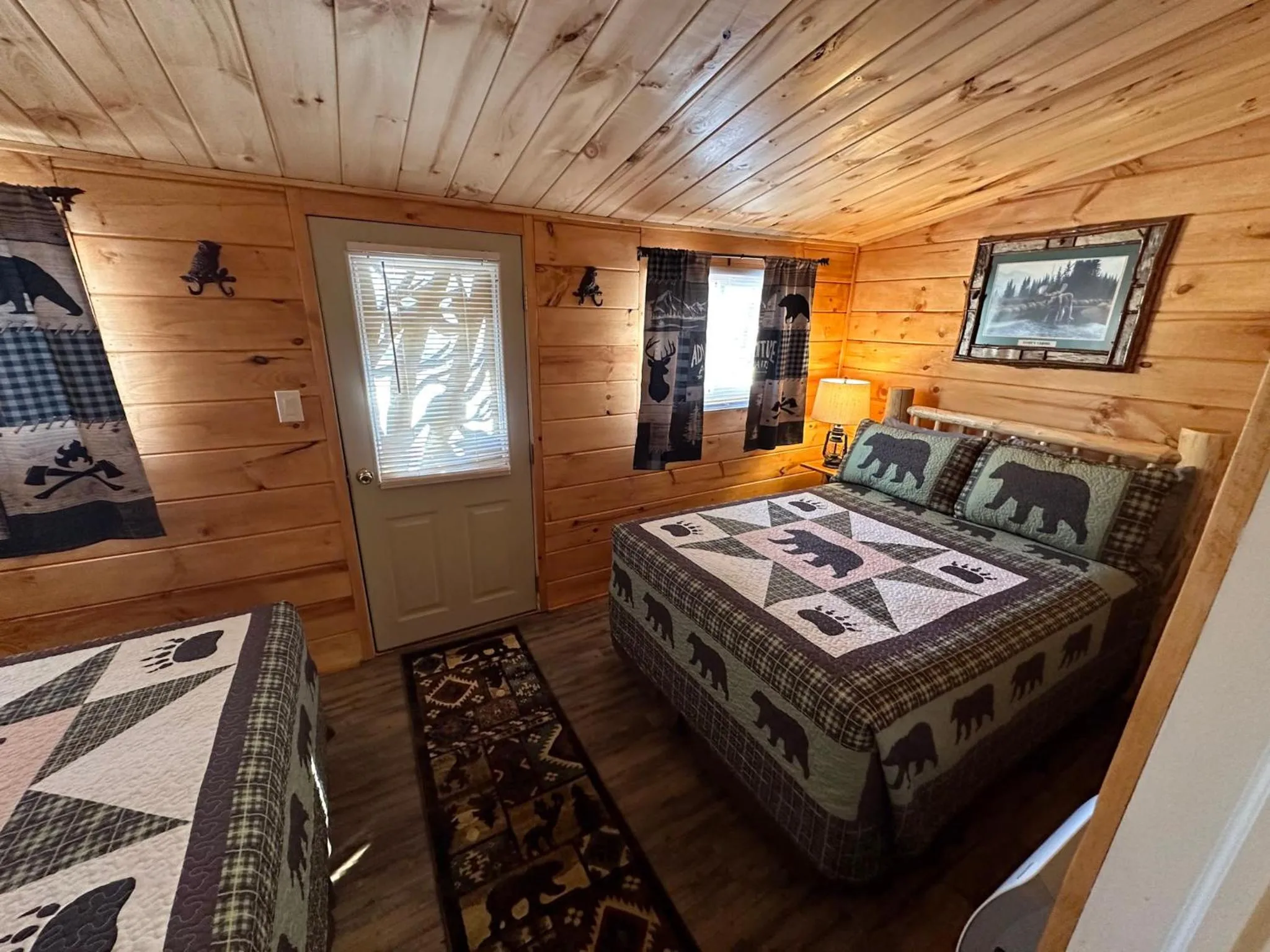 Bed in Rowe's Adirondack Cabins of Schroon Lake
