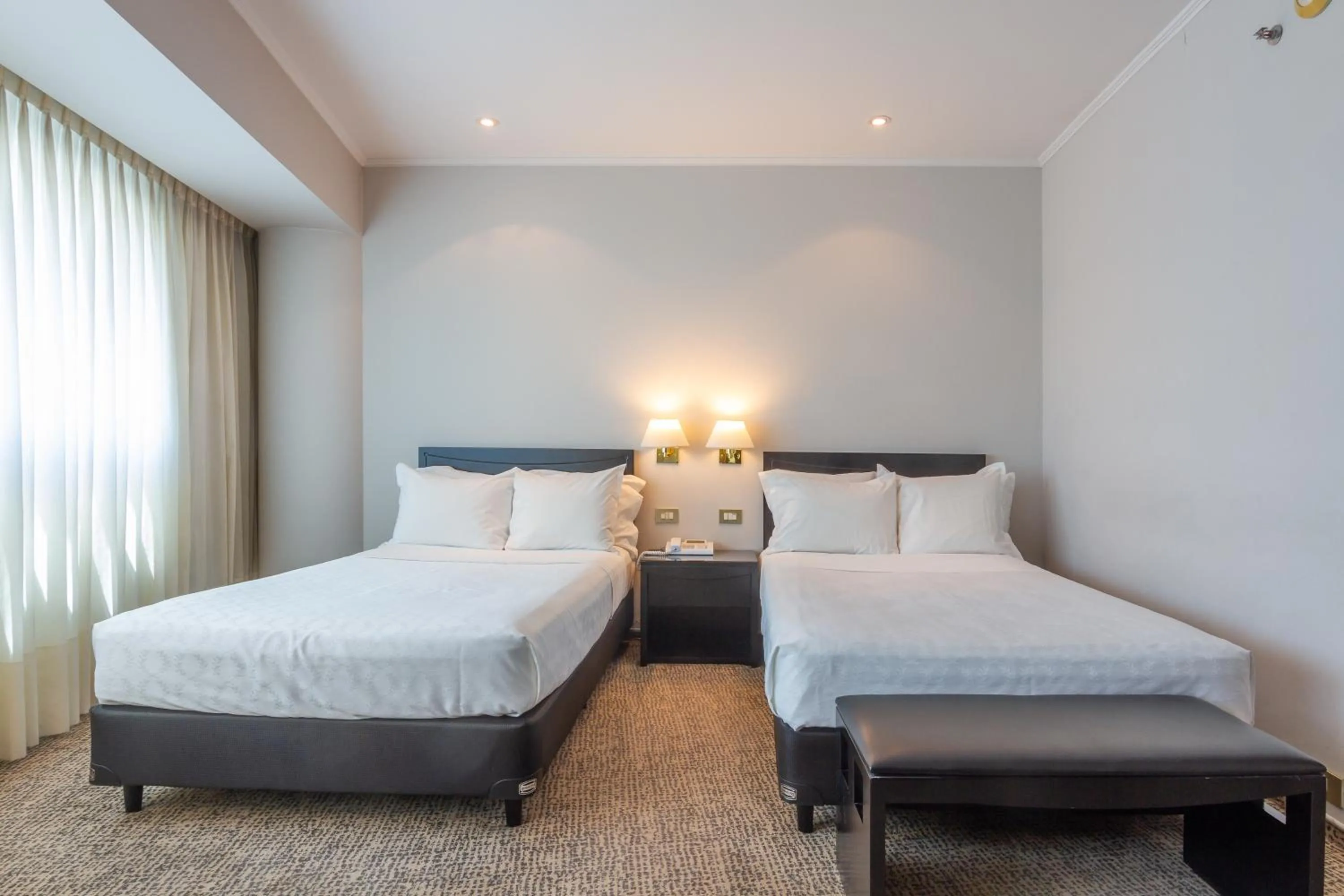 Bed in Quinto Centenario Hotel