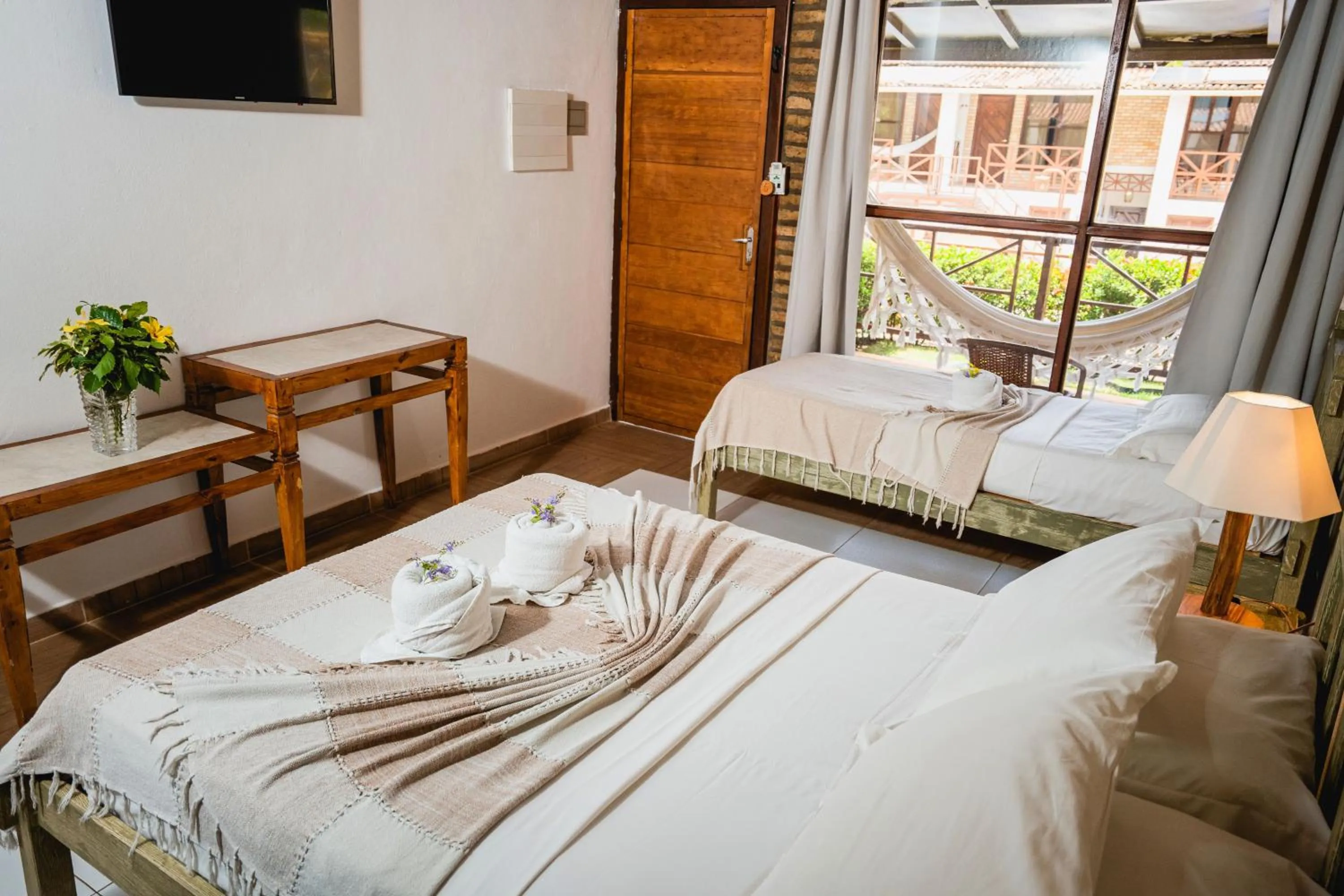 Bed in Pousada Bicho Preguiça