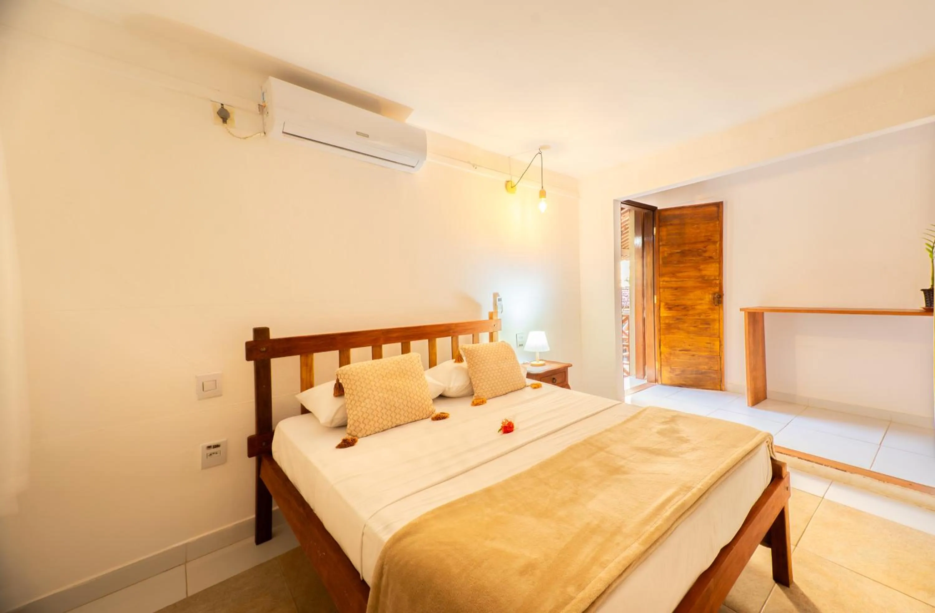 Bed in Pousada Bicho Preguiça