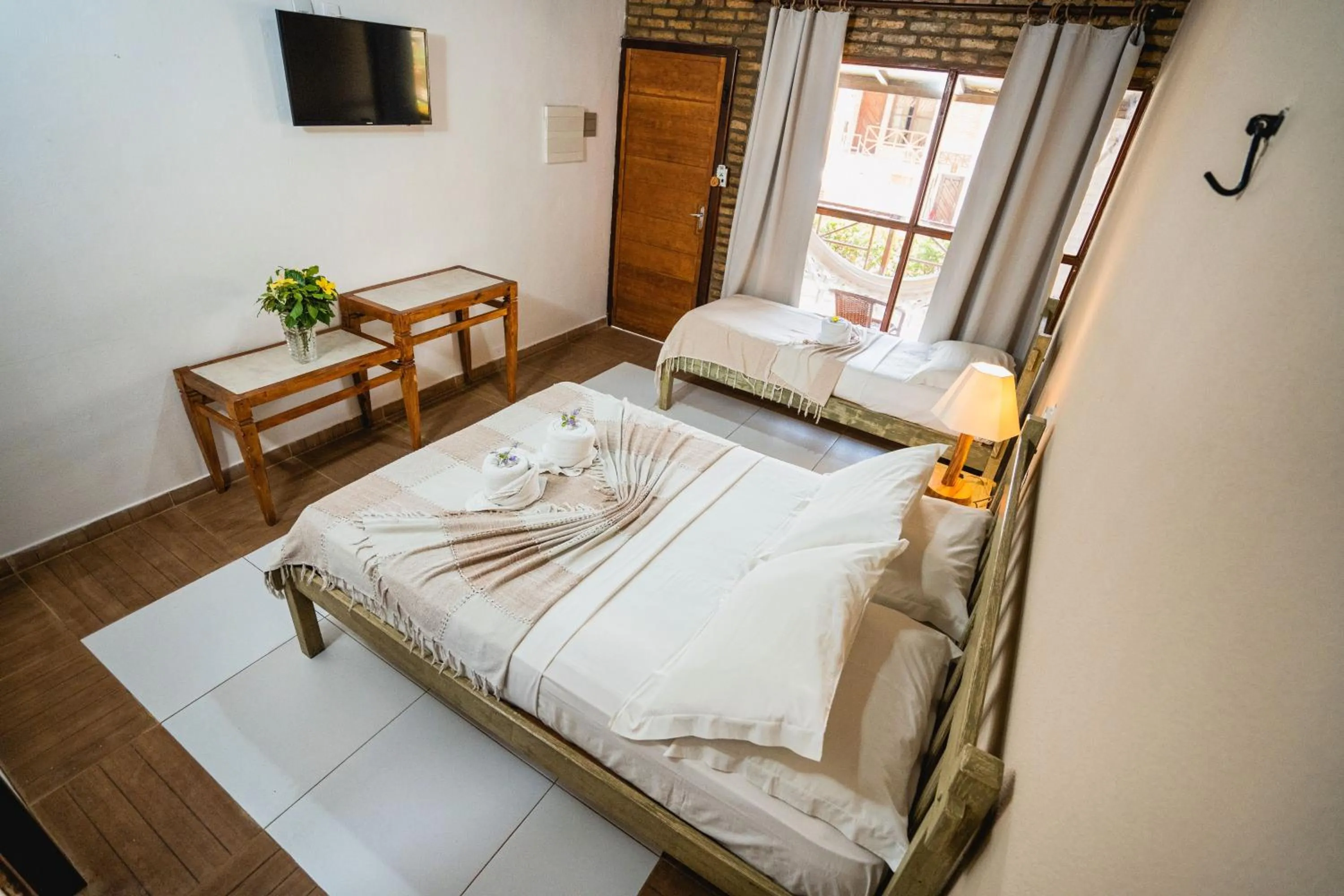 Bed in Pousada Bicho Preguiça