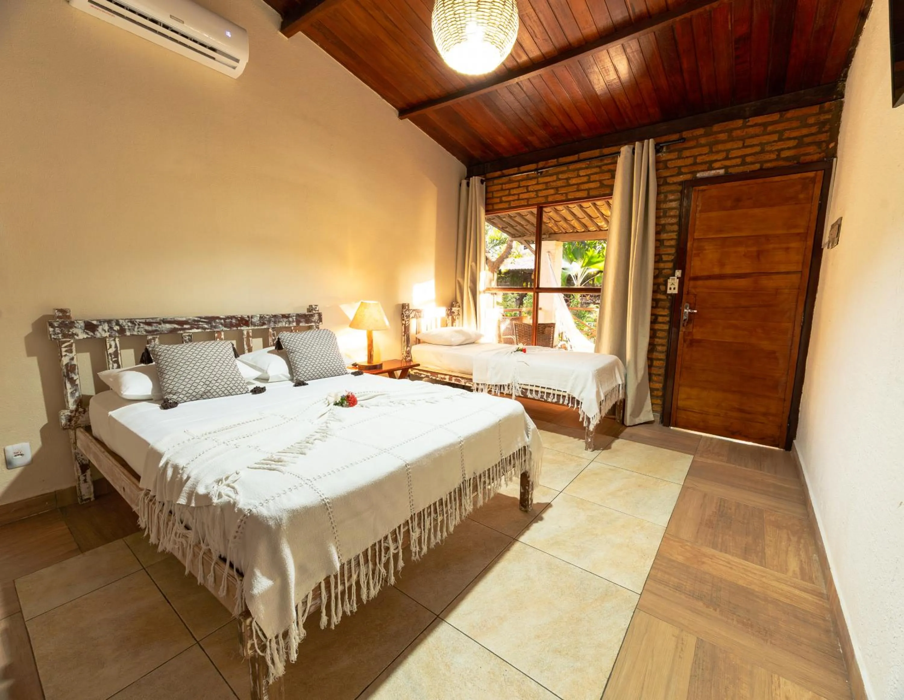 Bed in Pousada Bicho Preguiça