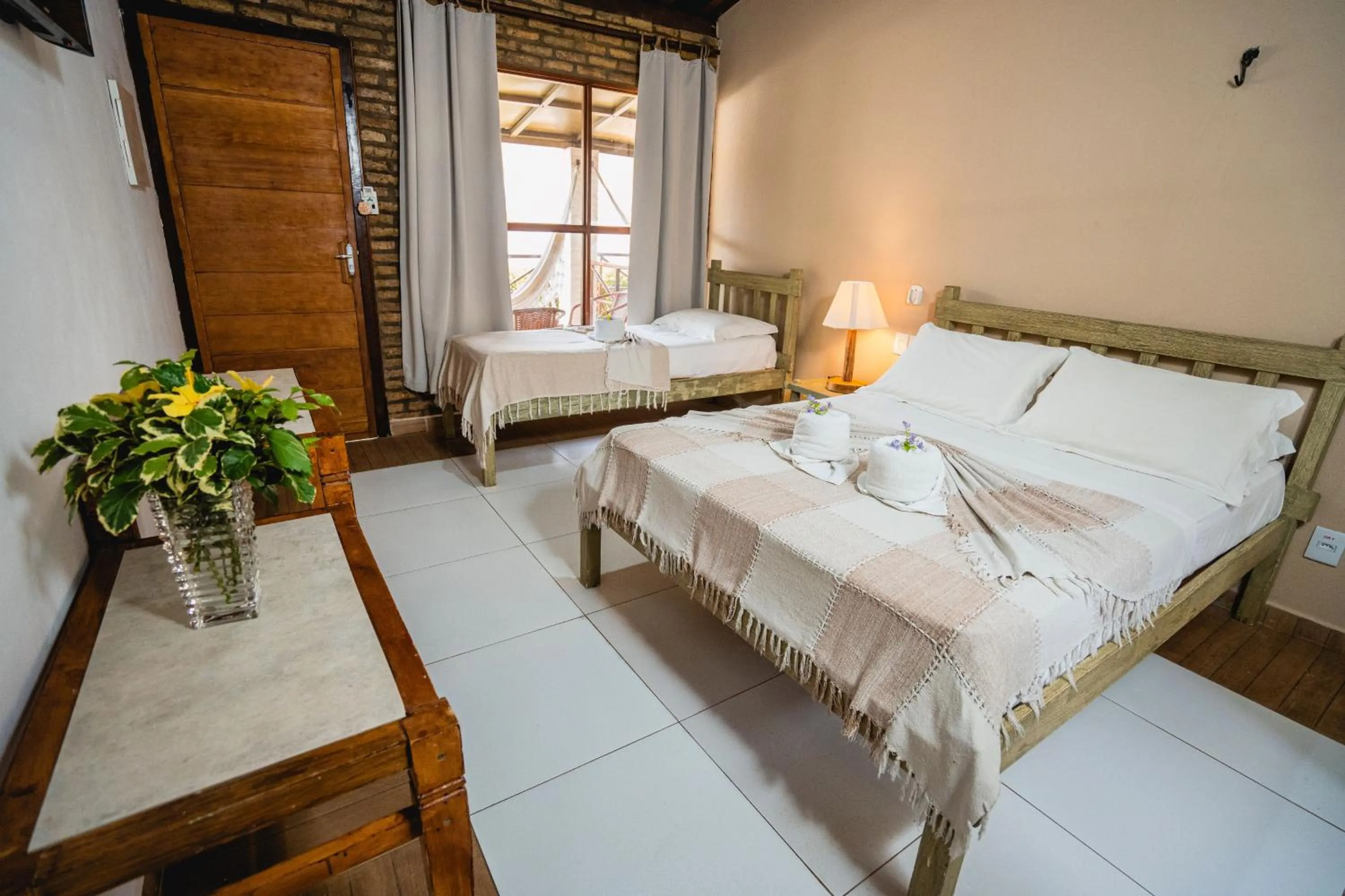 Bed in Pousada Bicho Preguiça