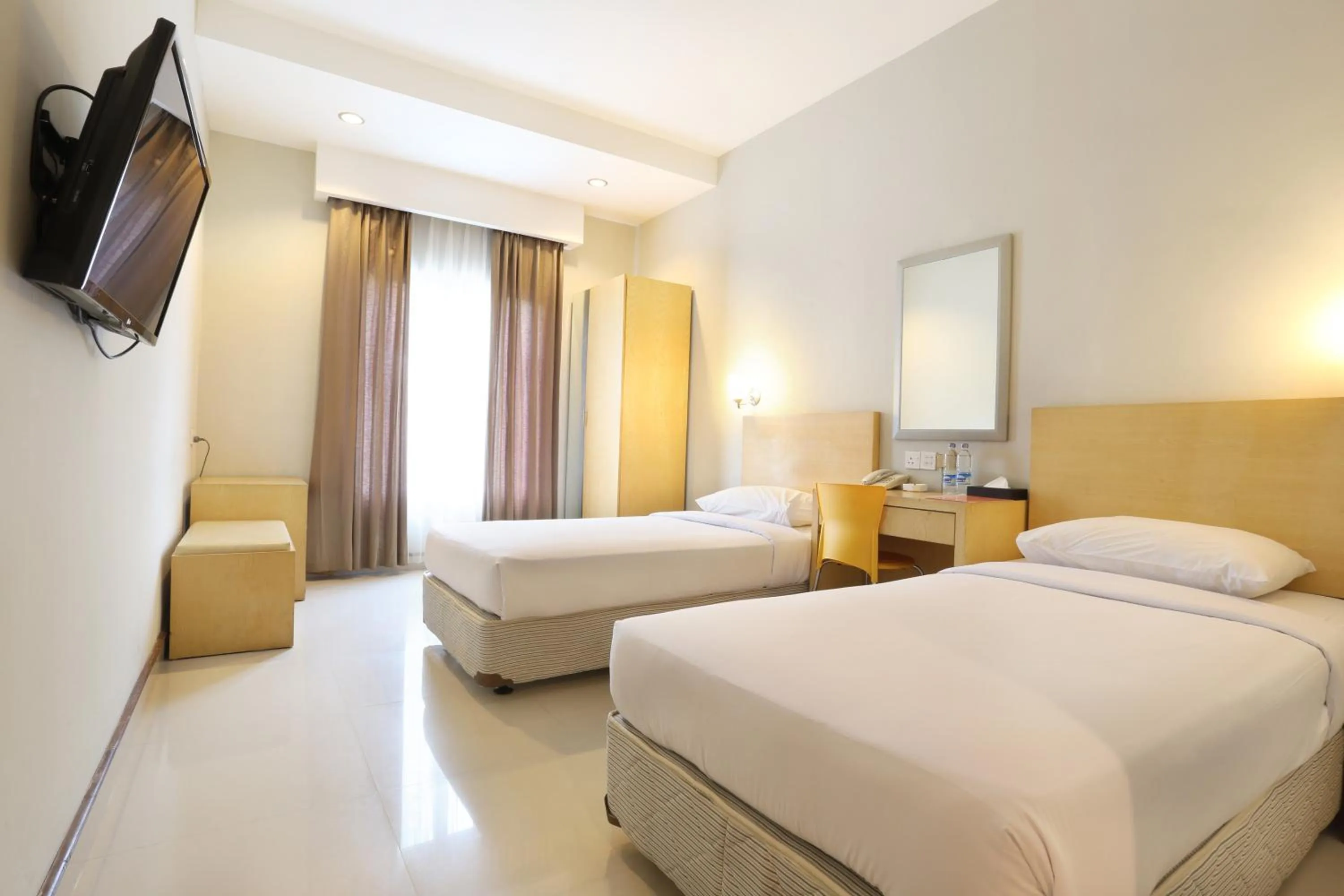 Photo of the whole room, Bed in Triniti Hotel Batam