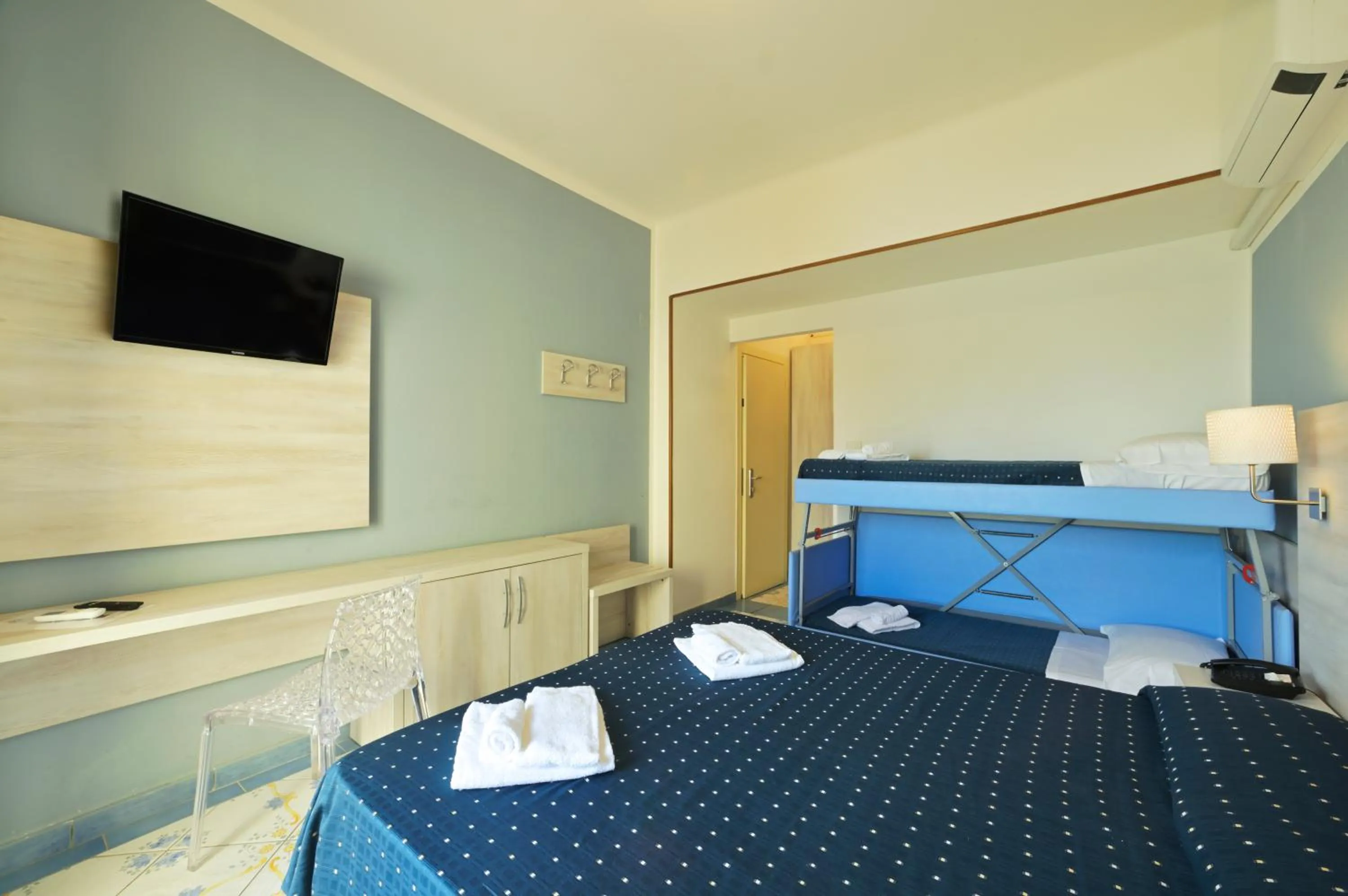 Bed in Hotel Delfino