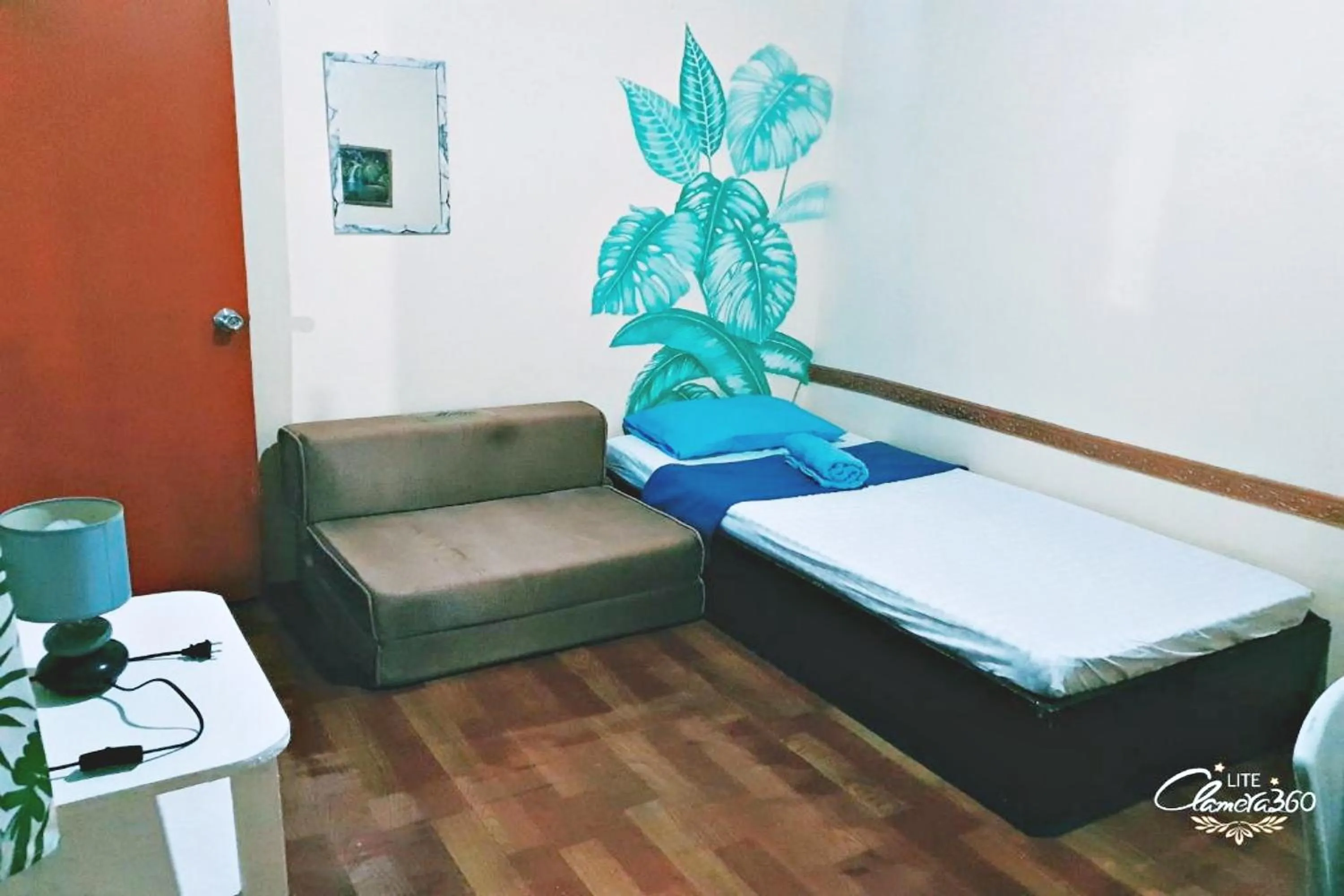 Living room, Bed in Angler's Hub & Resort Oslob